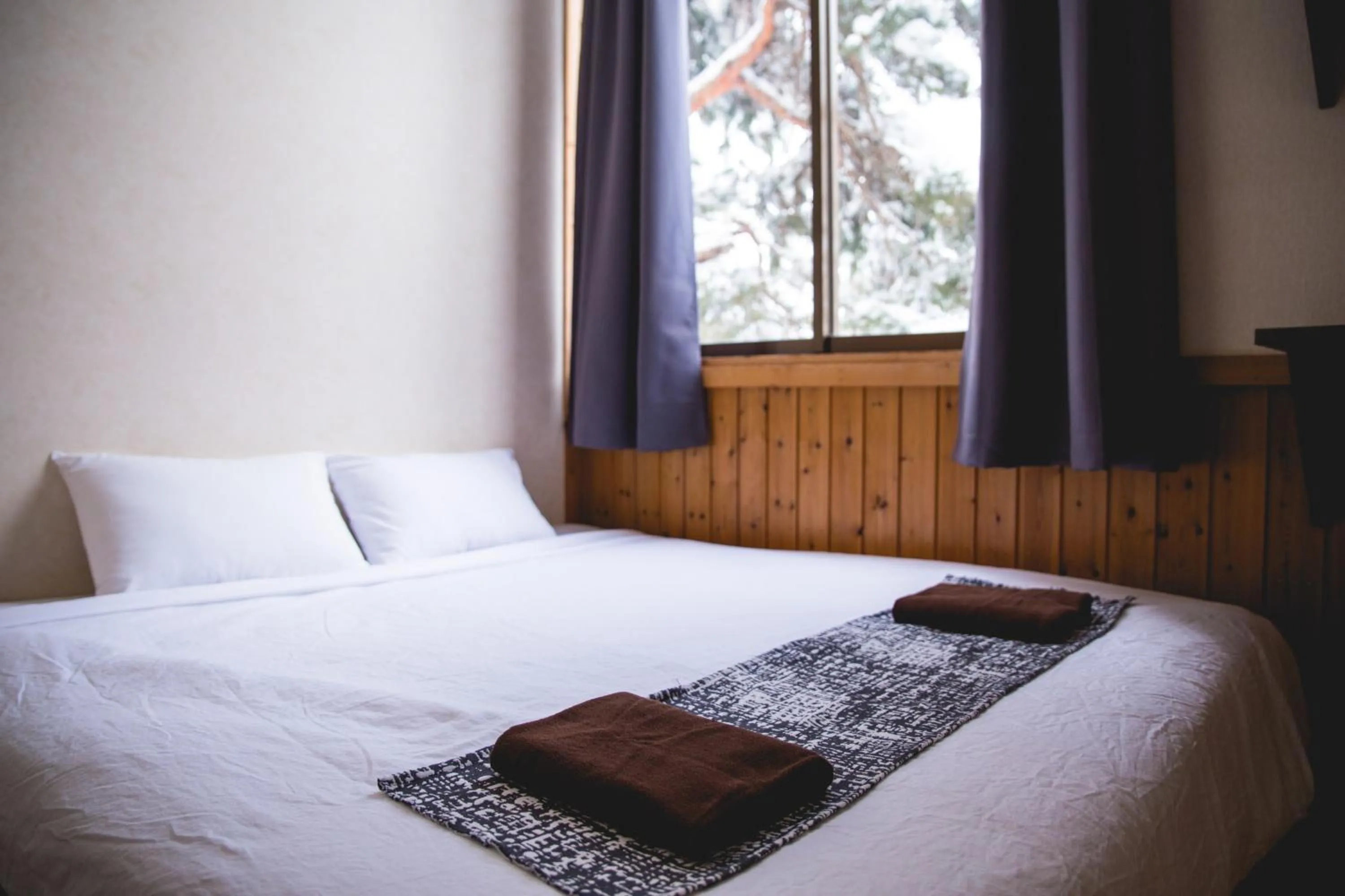 Bed in Hakuba Cortina Lodge