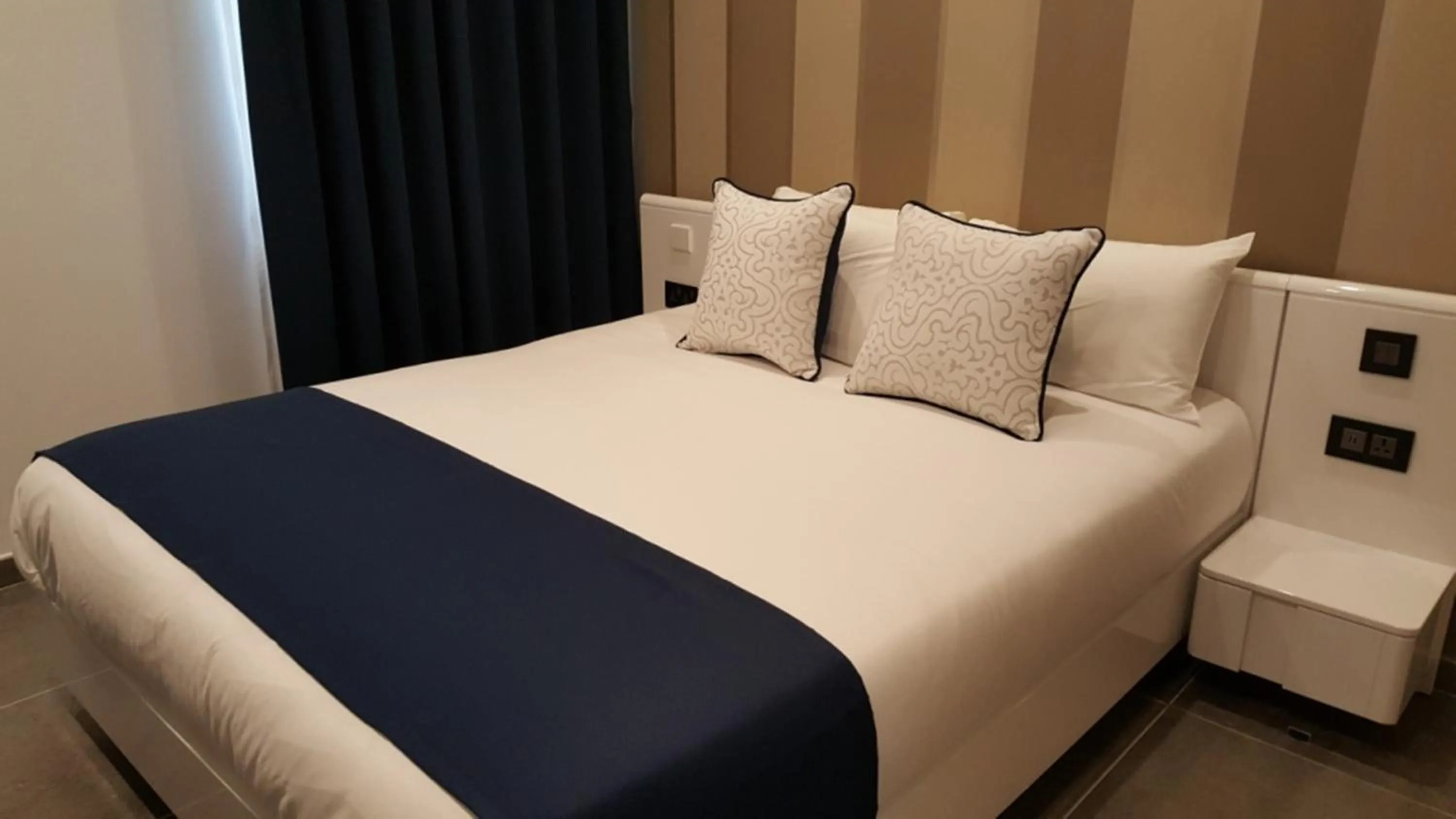 Bedroom in Pebbles Boutique Aparthotel