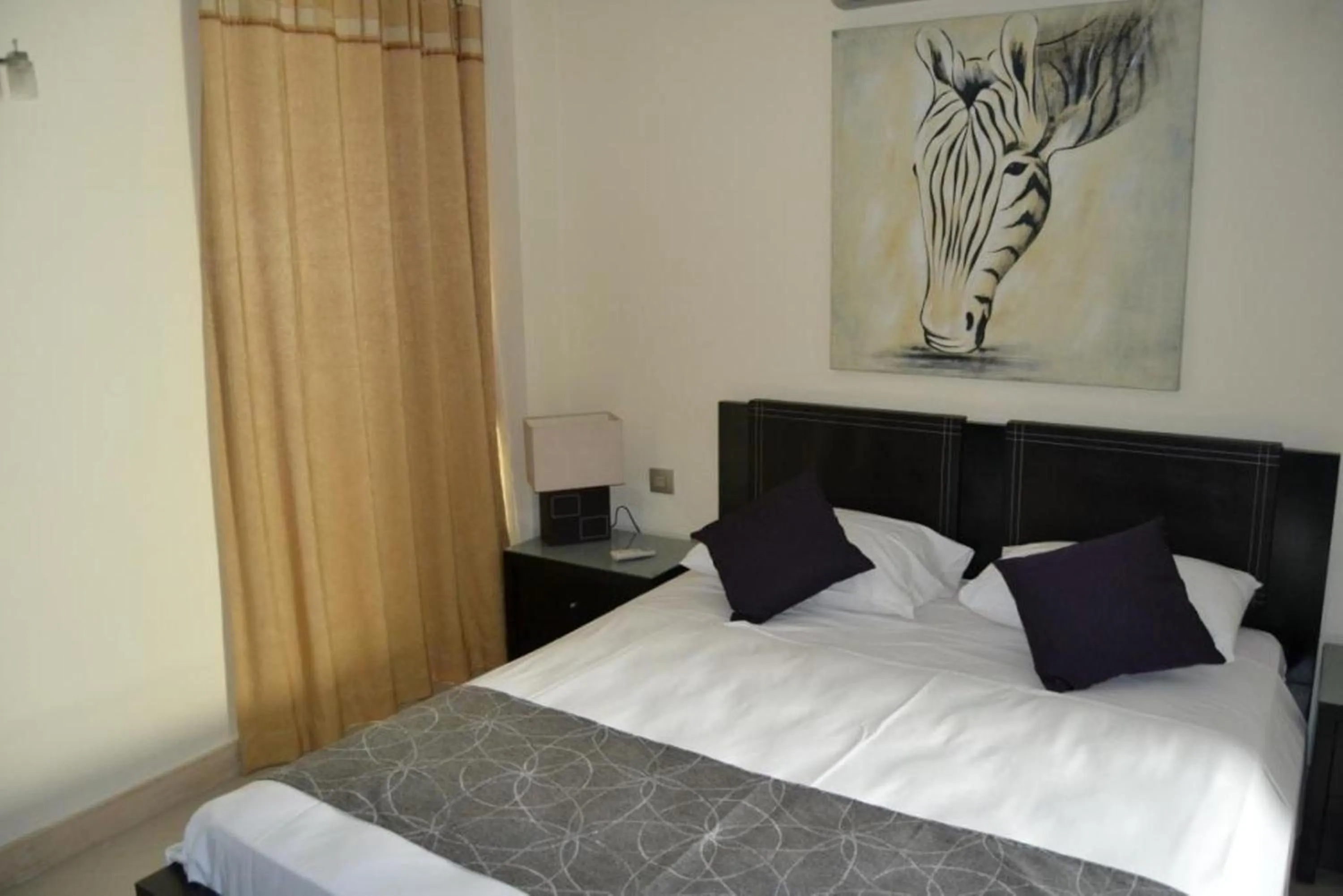 Bedroom in Pebbles Boutique Aparthotel