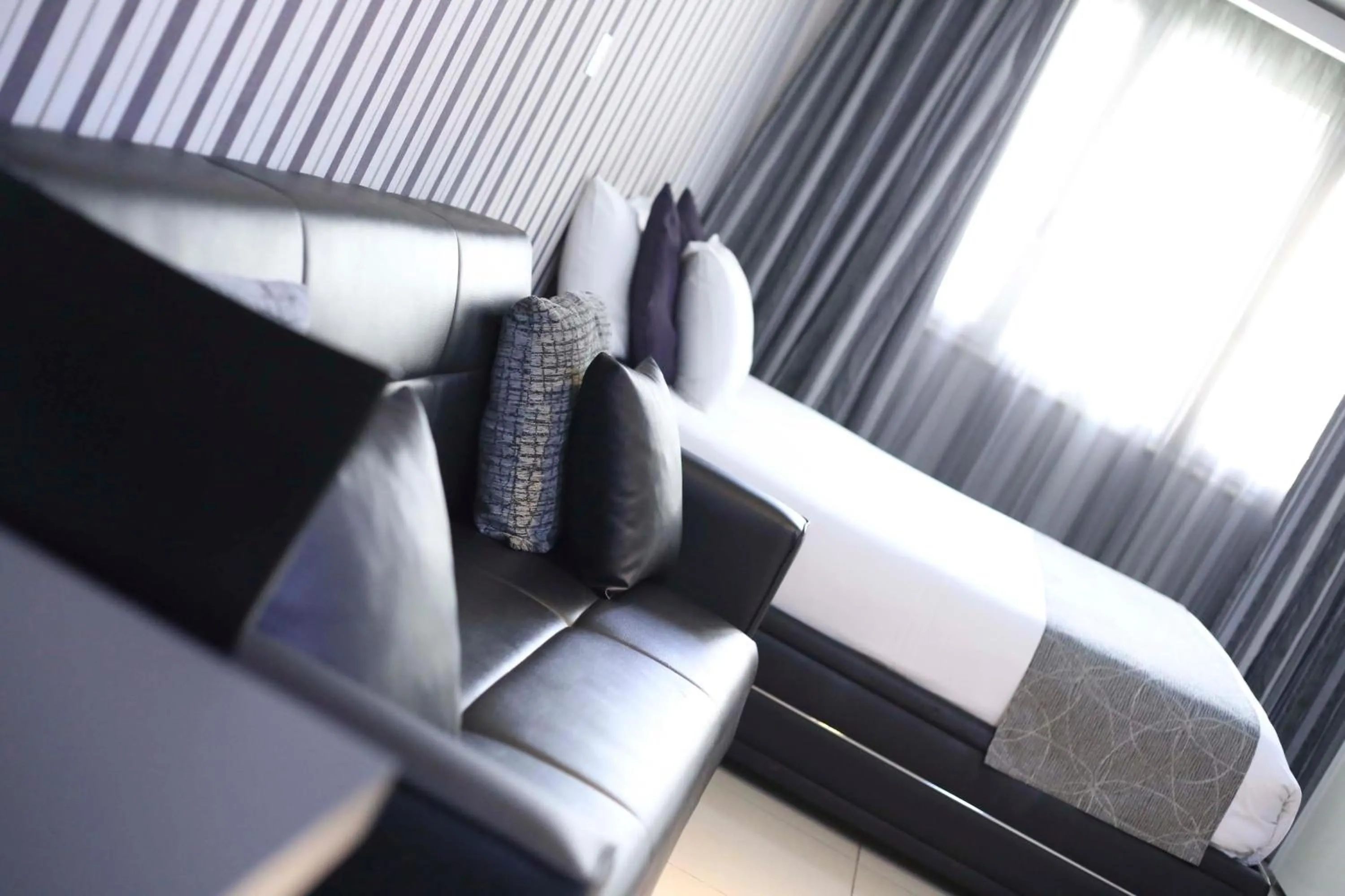 Bedroom, Seating Area in Pebbles Boutique Aparthotel