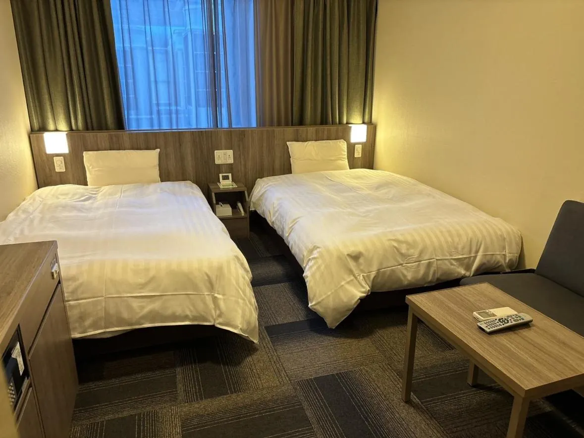 Bed in Dormy Inn Korakuen