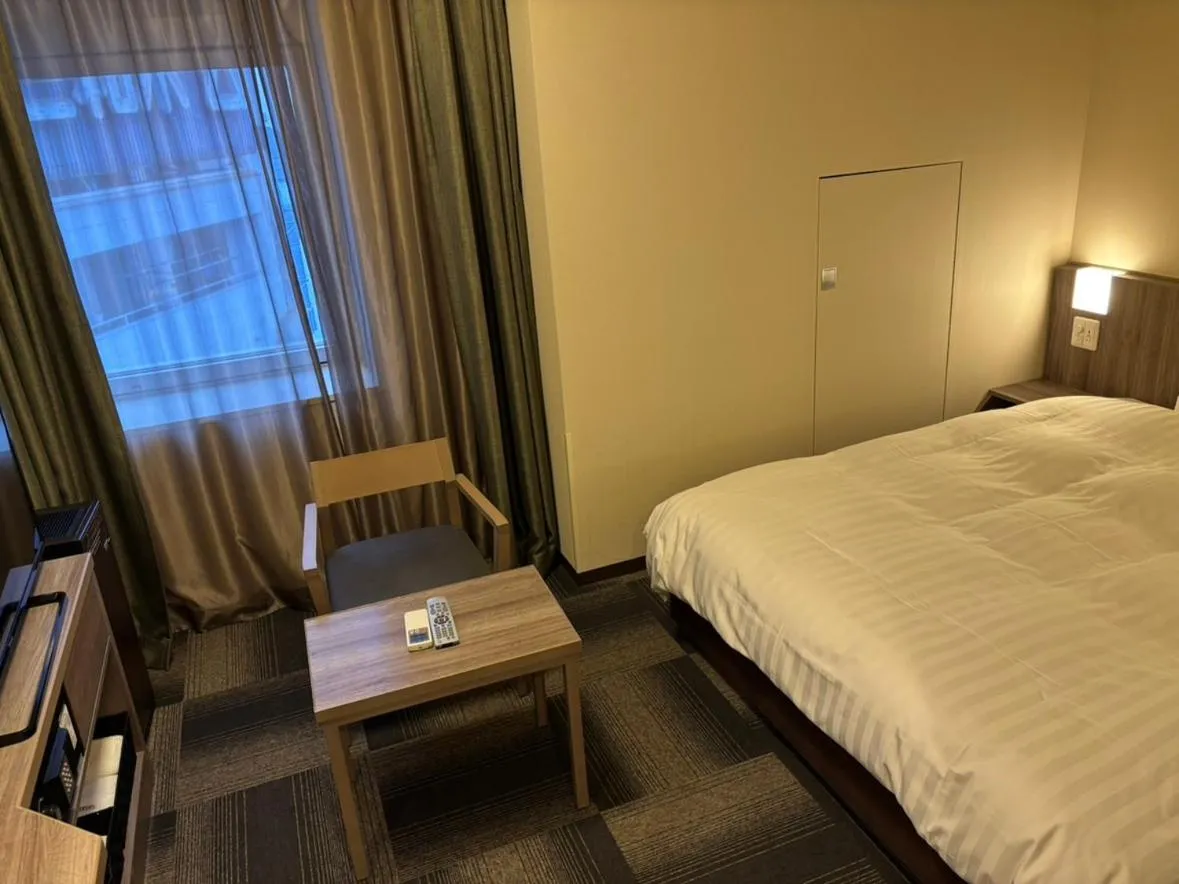 Bed in Dormy Inn Korakuen
