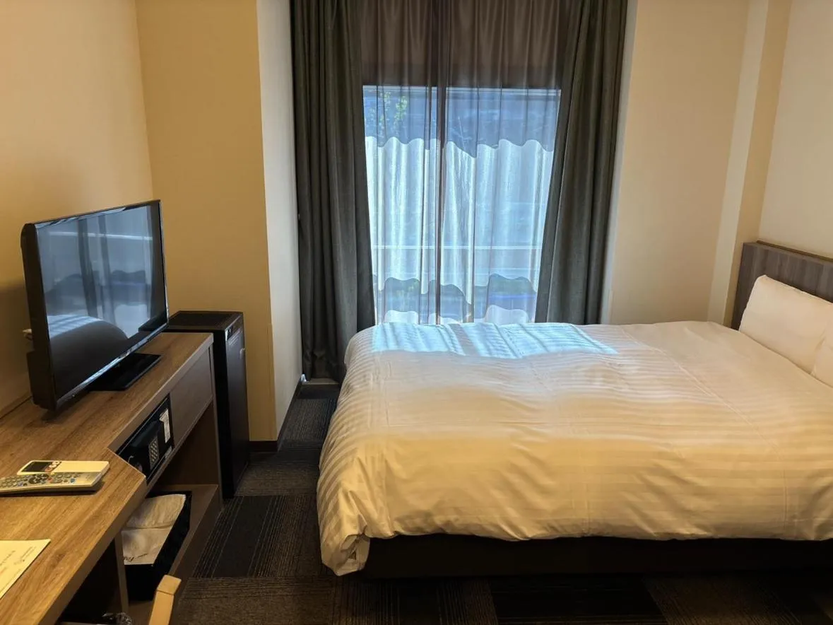 Bed in Dormy Inn Korakuen