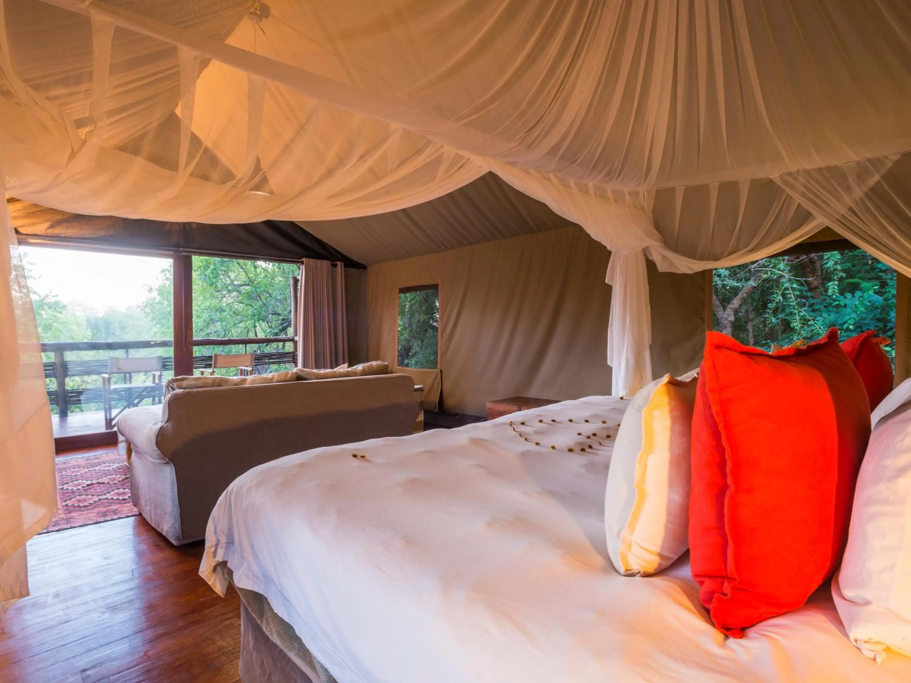 Bed in aha Thakadu River Camp