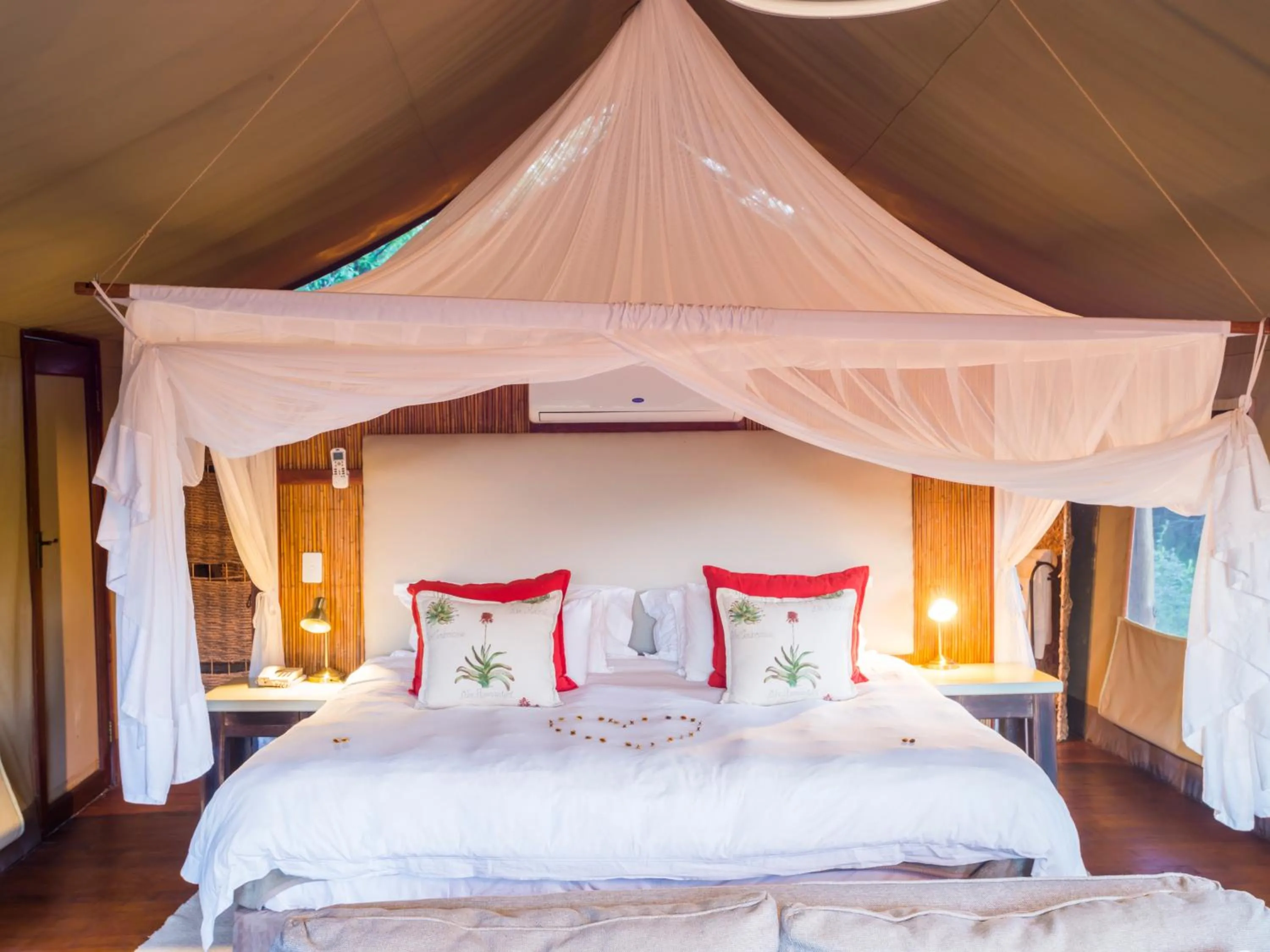 Bed in aha Thakadu River Camp