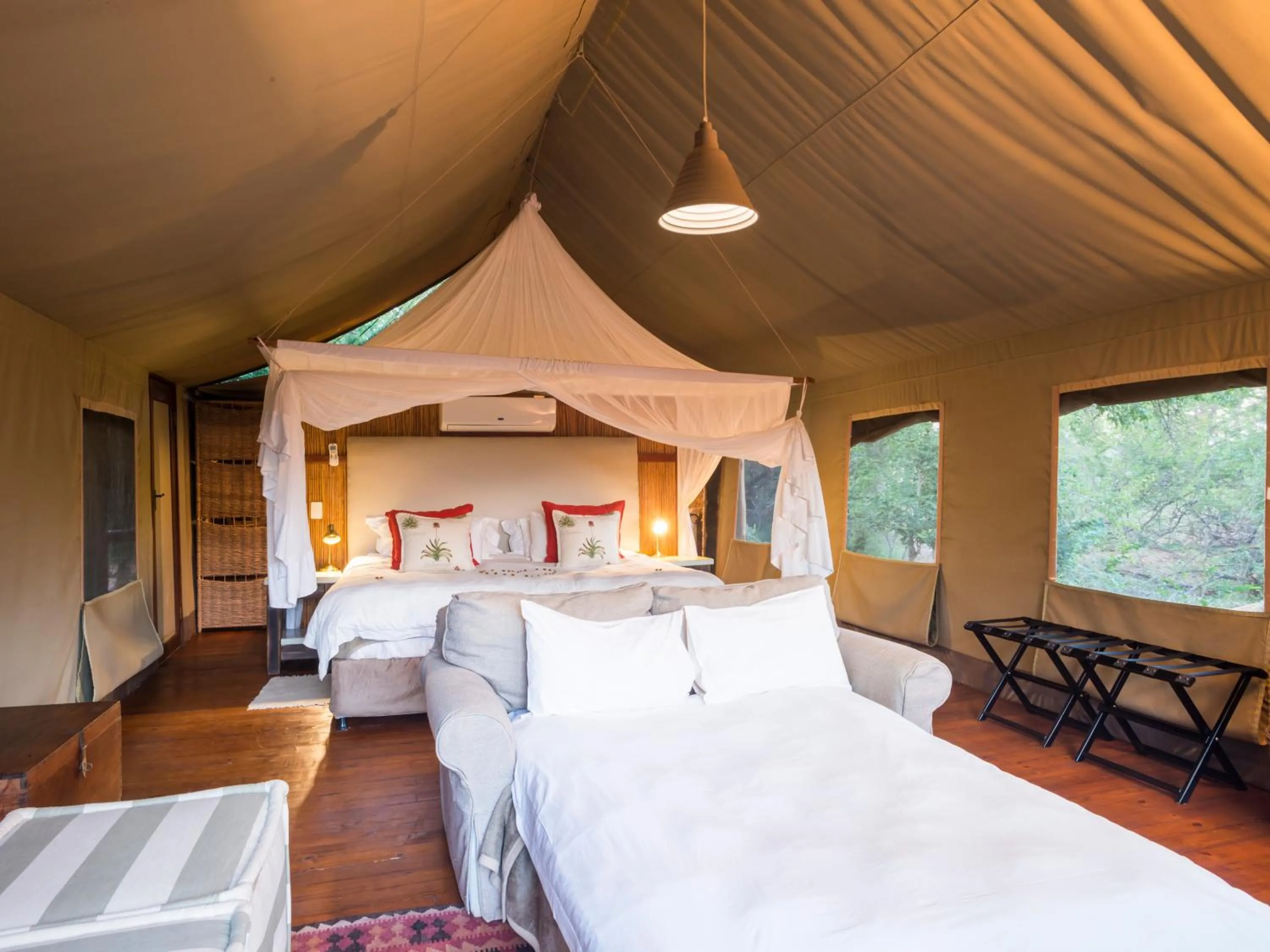 Bed in aha Thakadu River Camp