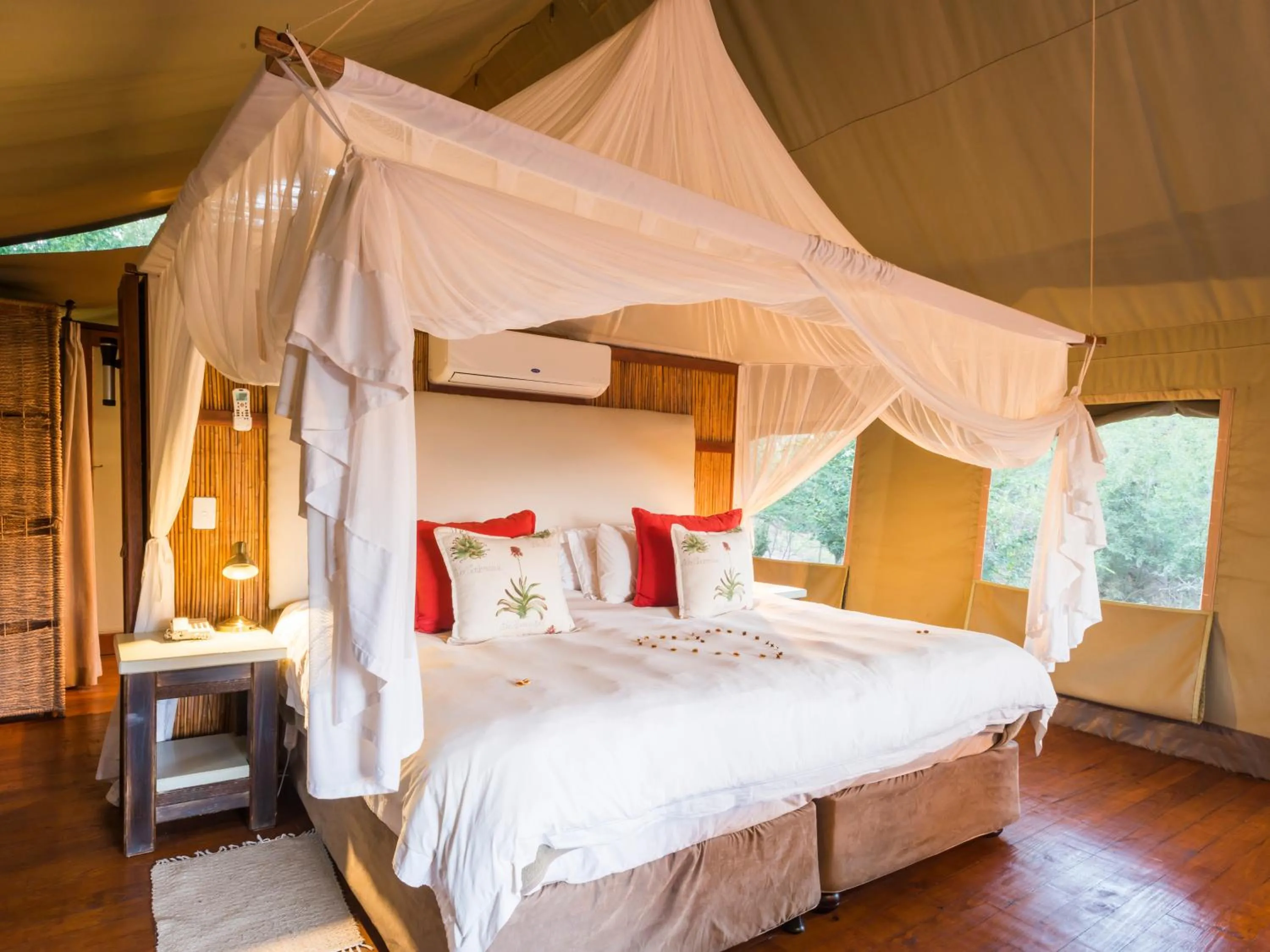 Bed in aha Thakadu River Camp