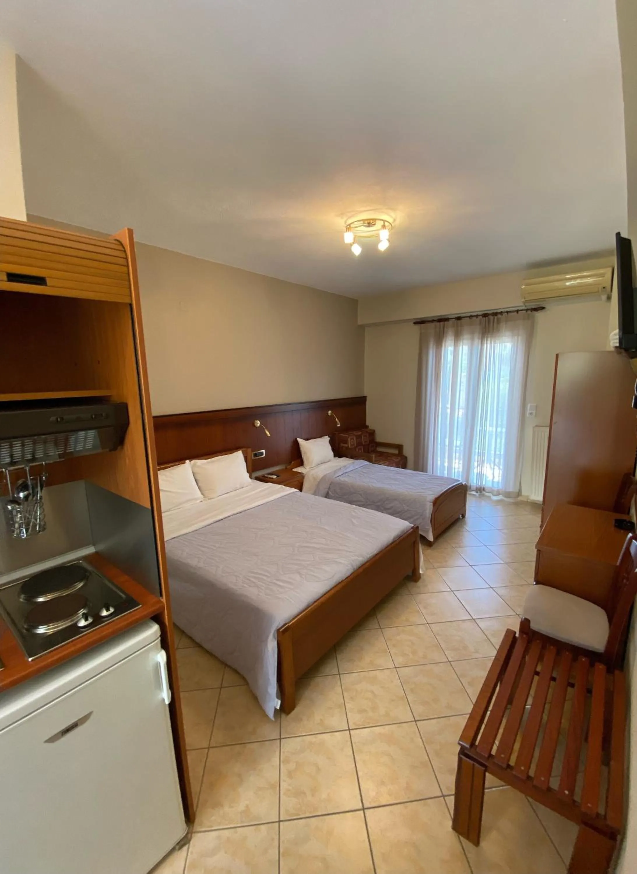 Bed in Paradosi Rooms