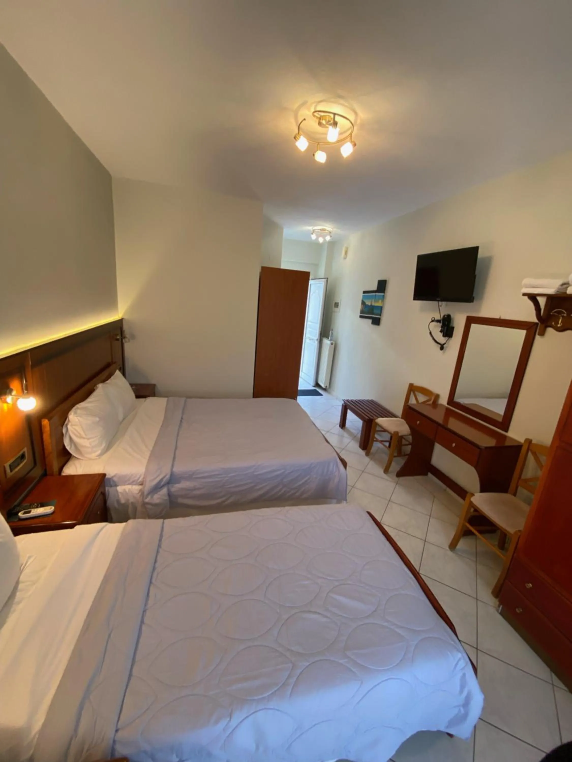 Bed in Paradosi Rooms