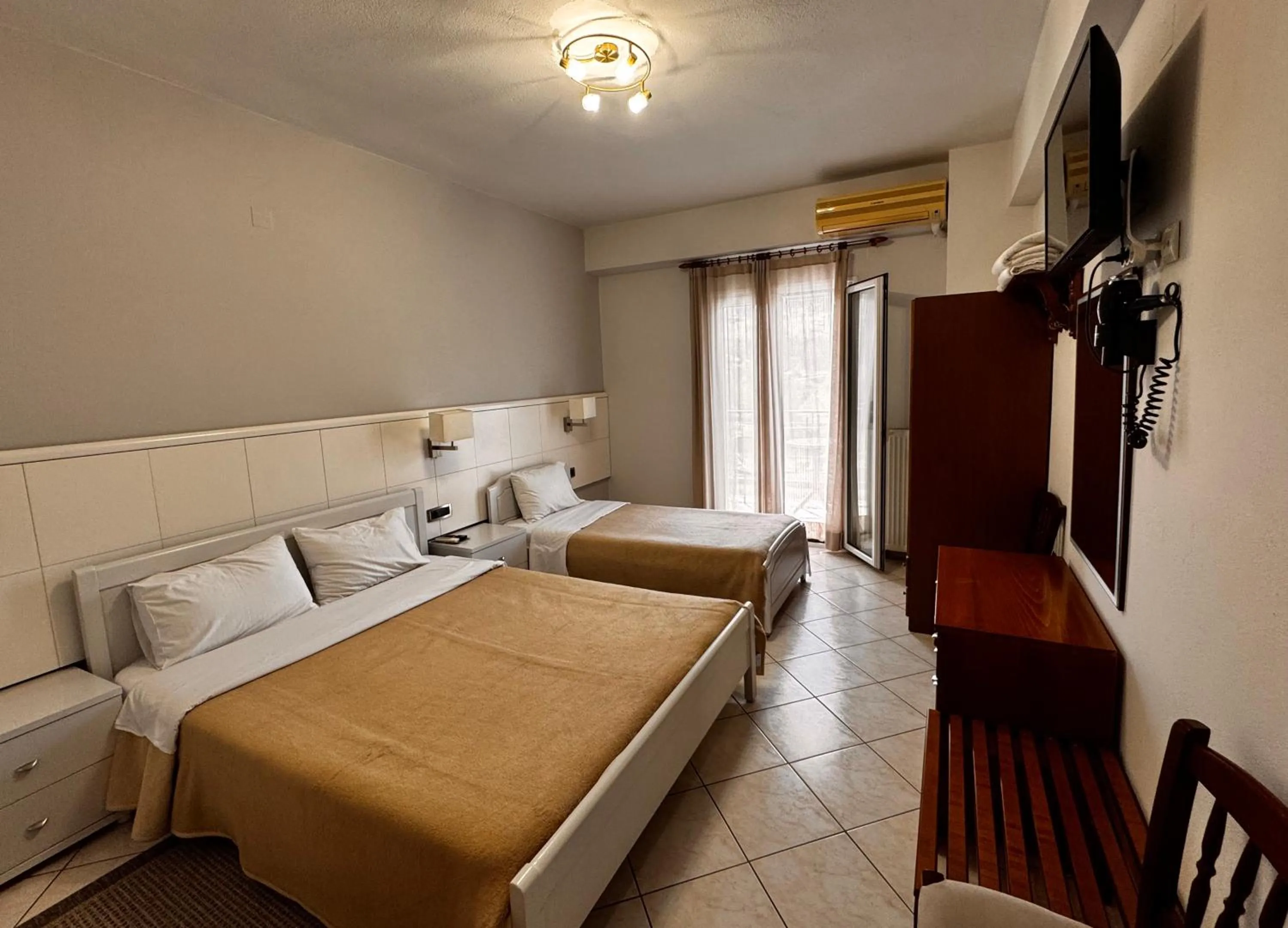 Bed in Paradosi Rooms