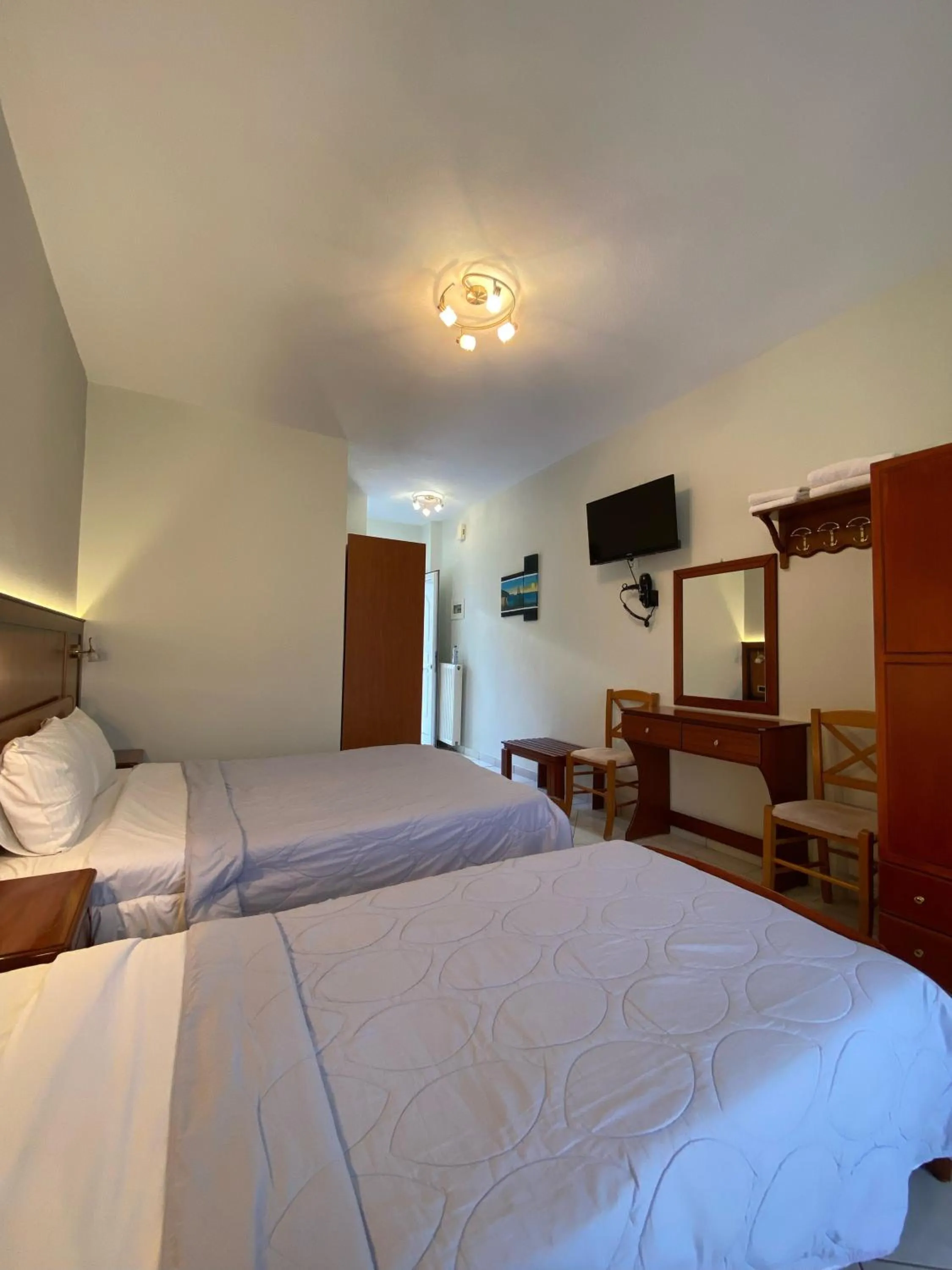 Bed in Paradosi Rooms