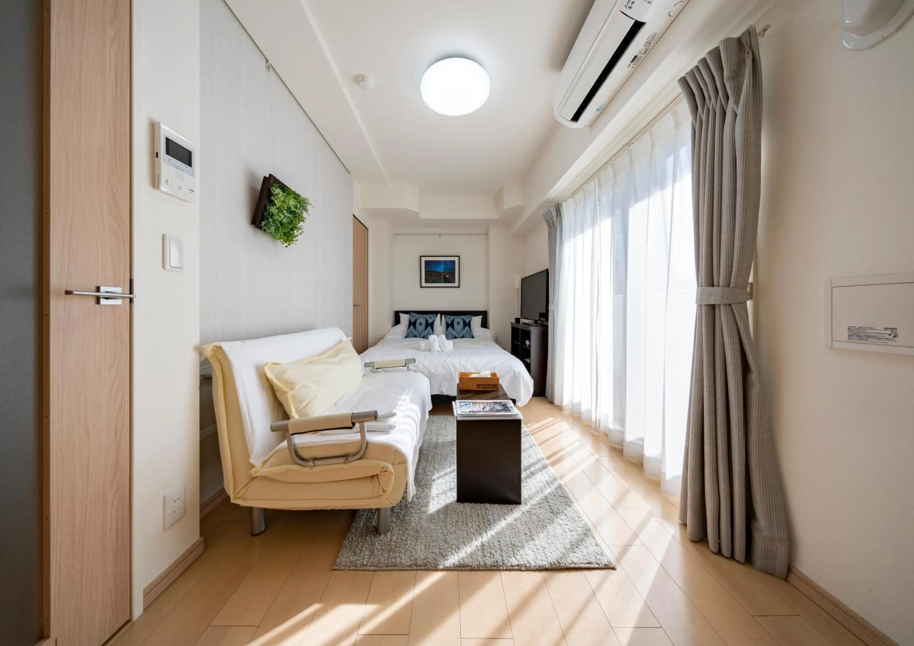 Living room, Bed in Meet Me Umeda Nishi