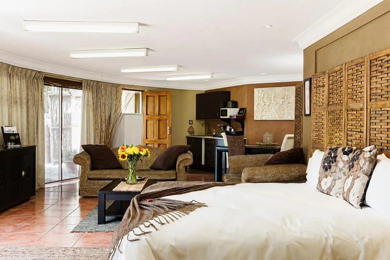 Photo of the whole room, Bed in Glenda's Guest Suites