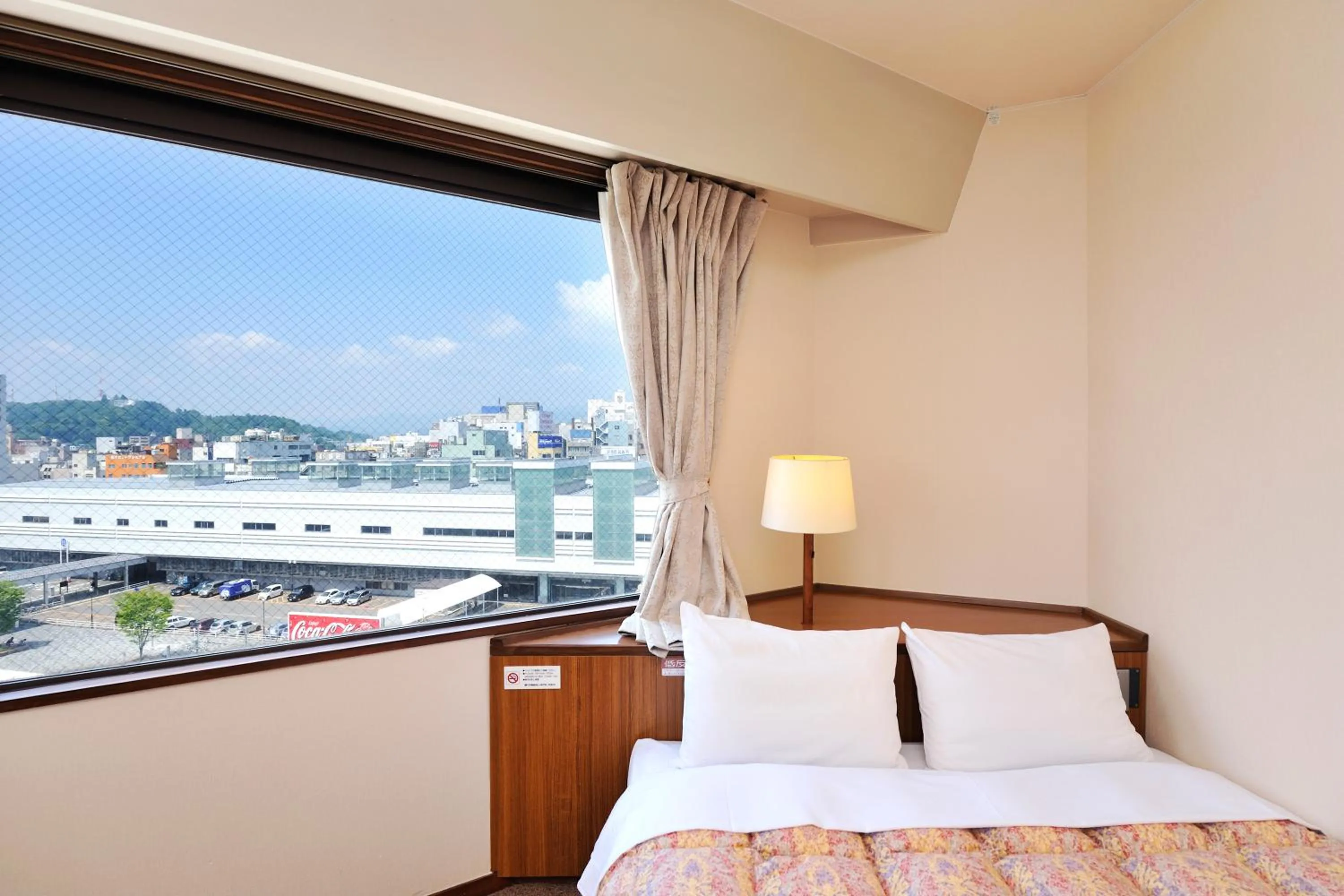 Bed in Hotel Keifuku Fukui Ekimae