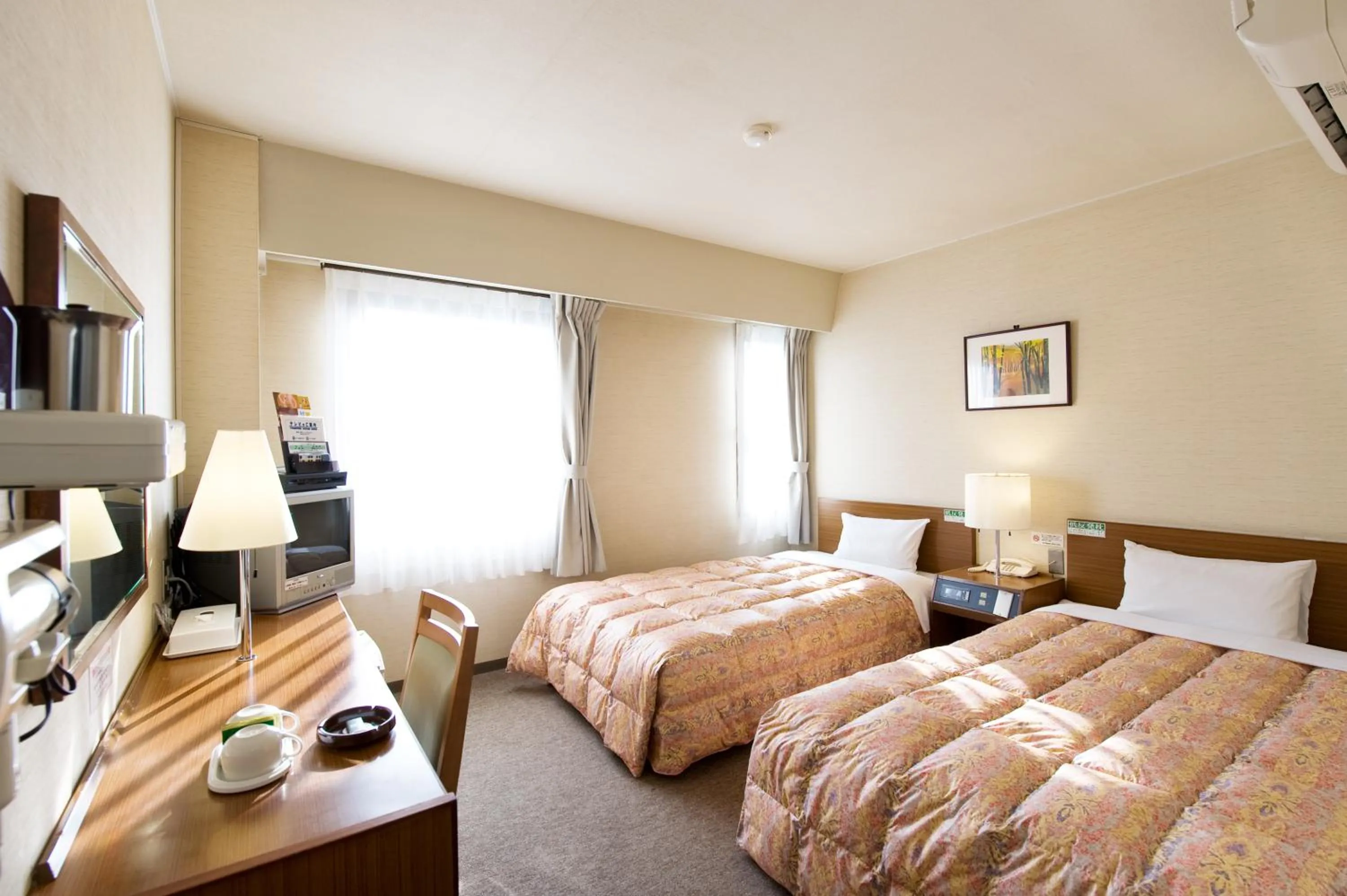 Bed in Hotel Keifuku Fukui Ekimae