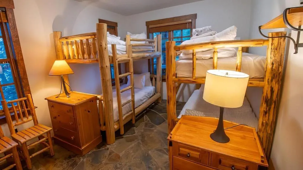 Bed in Snow Creek Cabins by Fernie Lodging Co