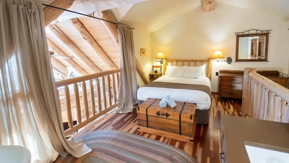 Bed in Snow Creek Cabins by Fernie Lodging Co