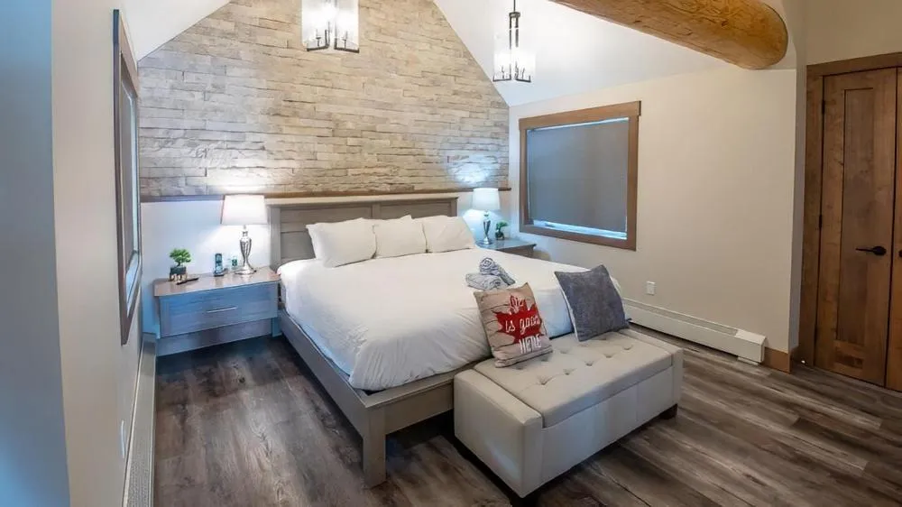 Bed in Snow Creek Cabins by Fernie Lodging Co