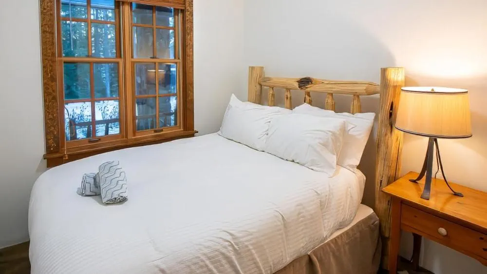 Bed in Snow Creek Cabins by Fernie Lodging Co