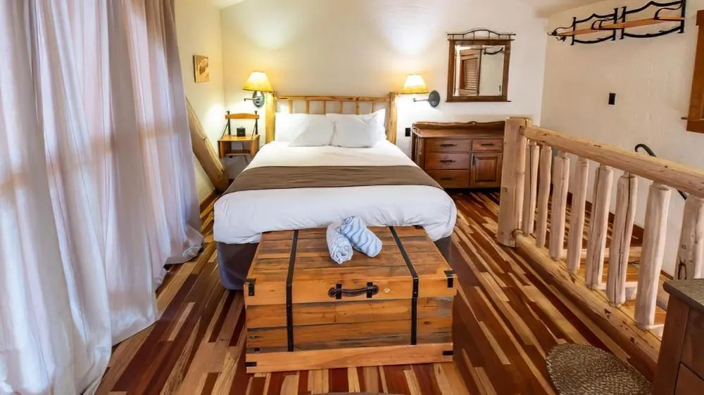 Bed in Snow Creek Cabins by Fernie Lodging Co