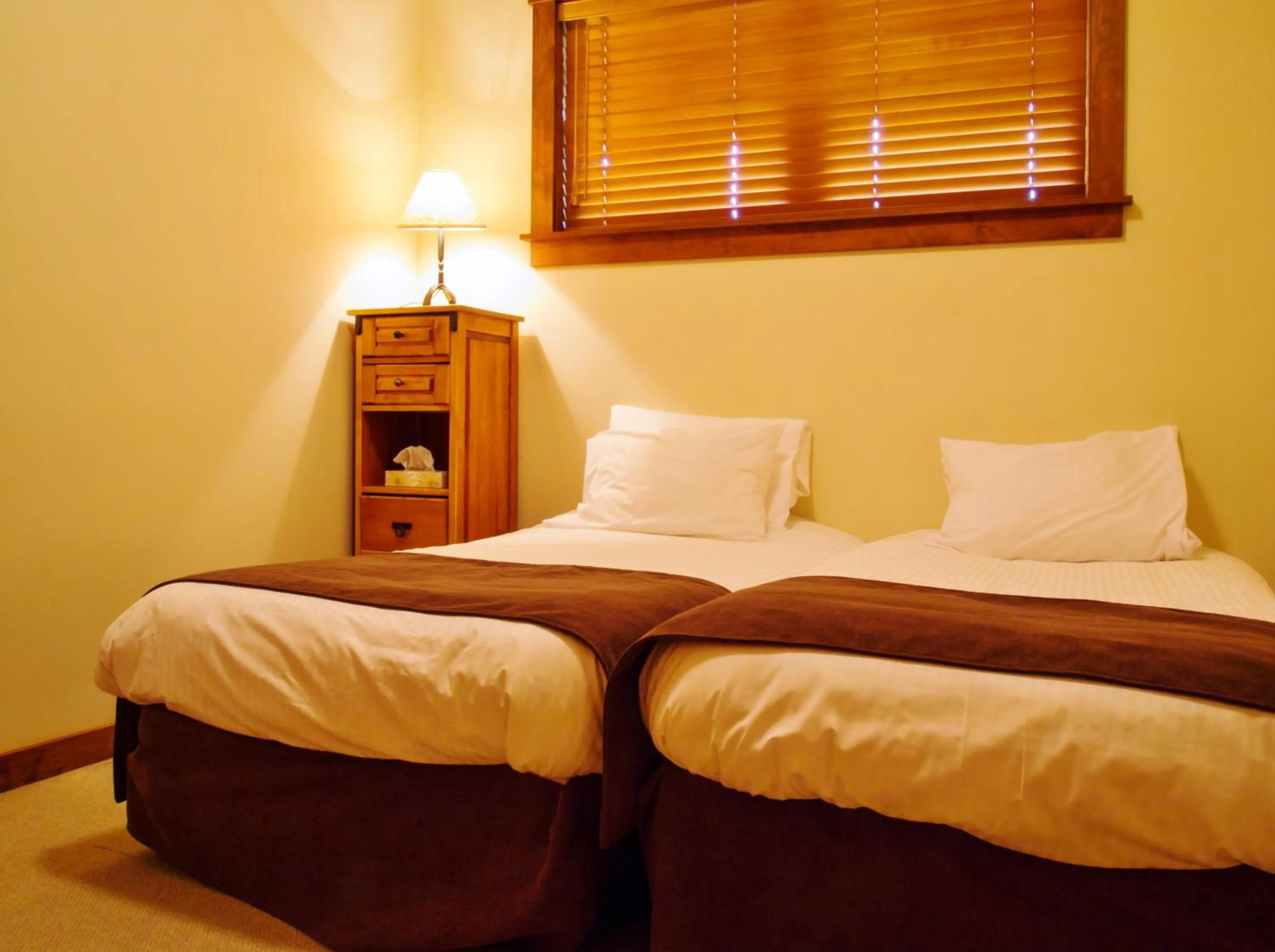 Bedroom, Bed in Snow Creek Cabins by Fernie Lodging Co