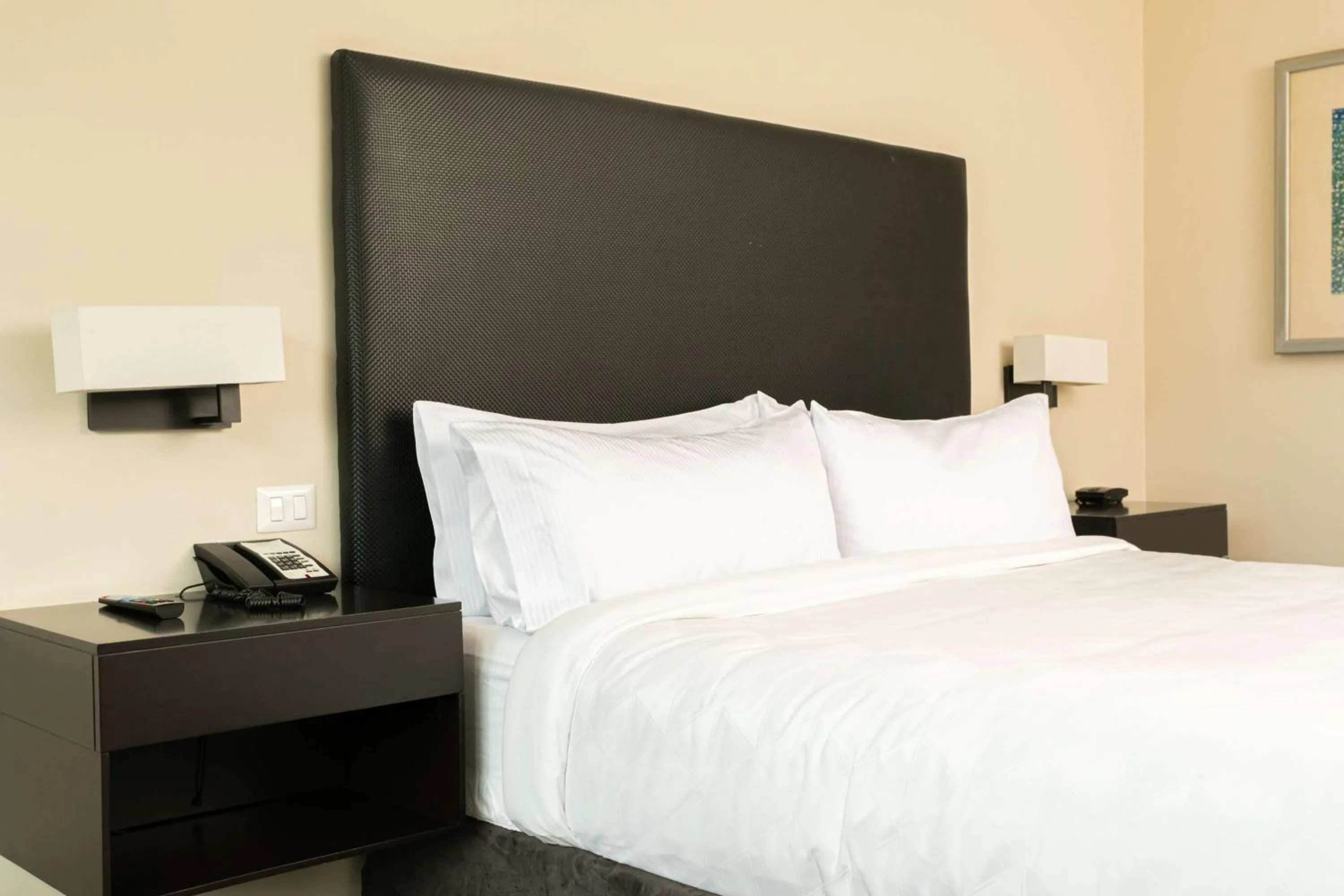 Bed in Crowne Plaza San Salvador, an IHG Hotel