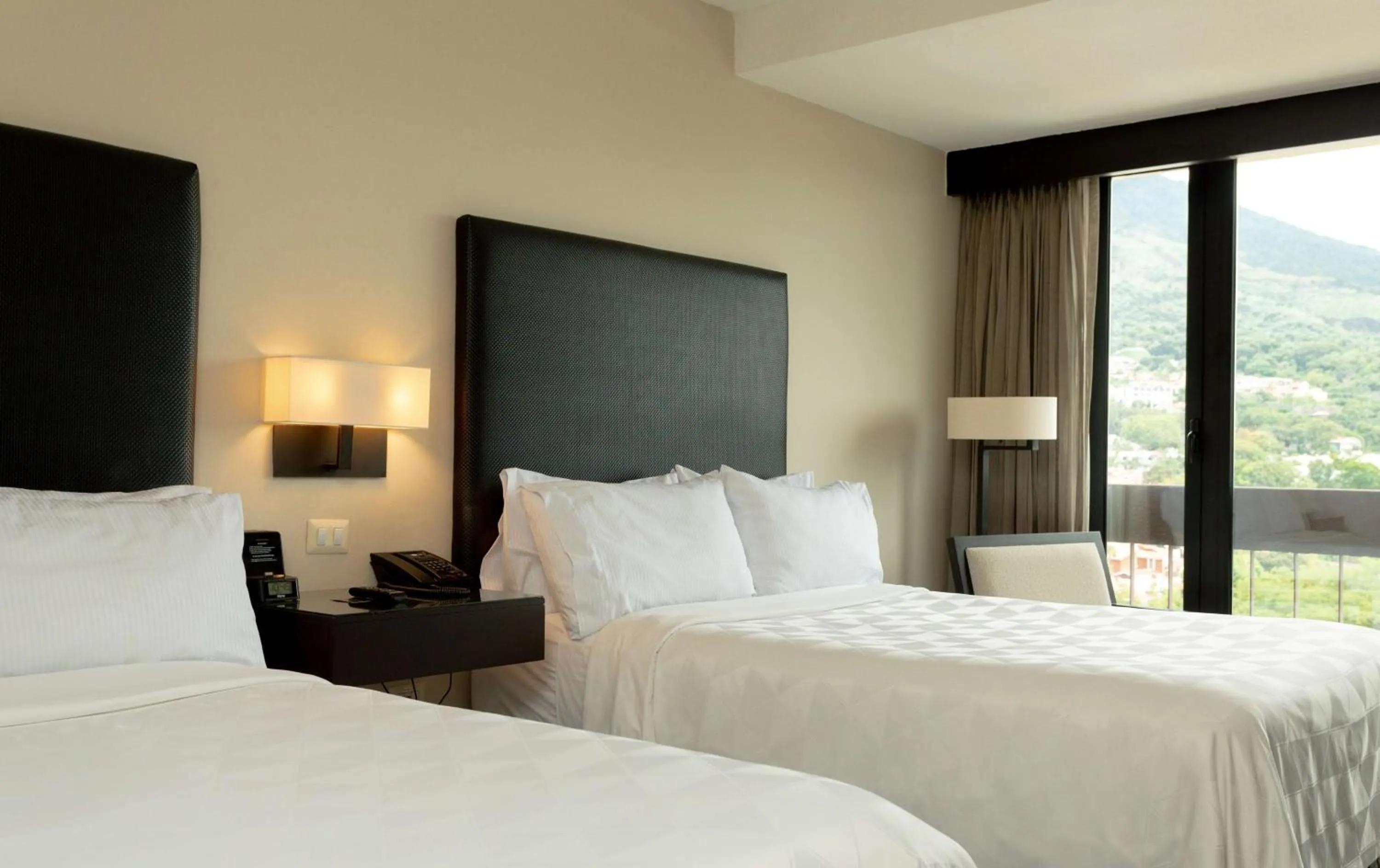 Bed in Crowne Plaza San Salvador, an IHG Hotel