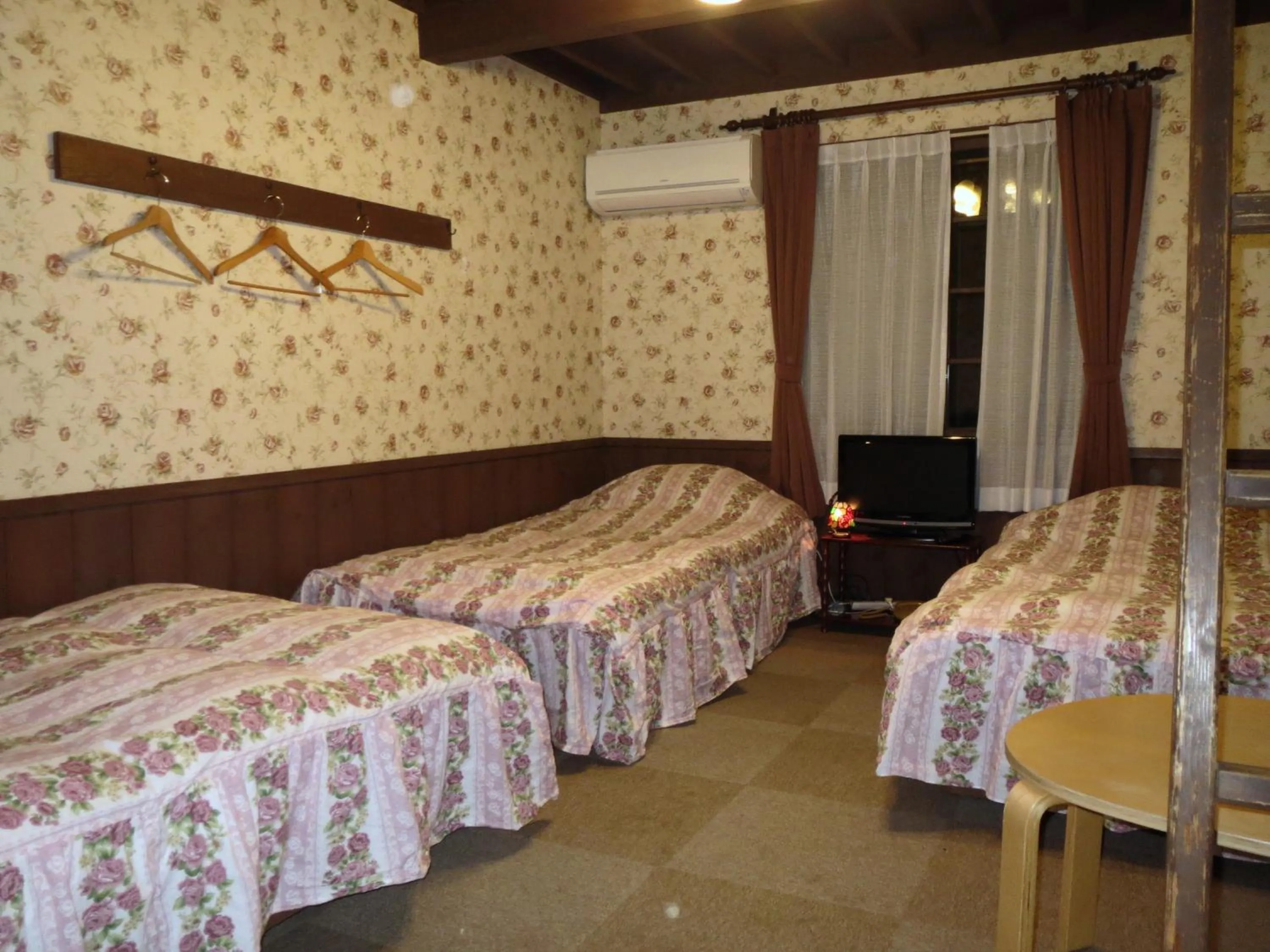 Photo of the whole room, Bed in Pension Marionette