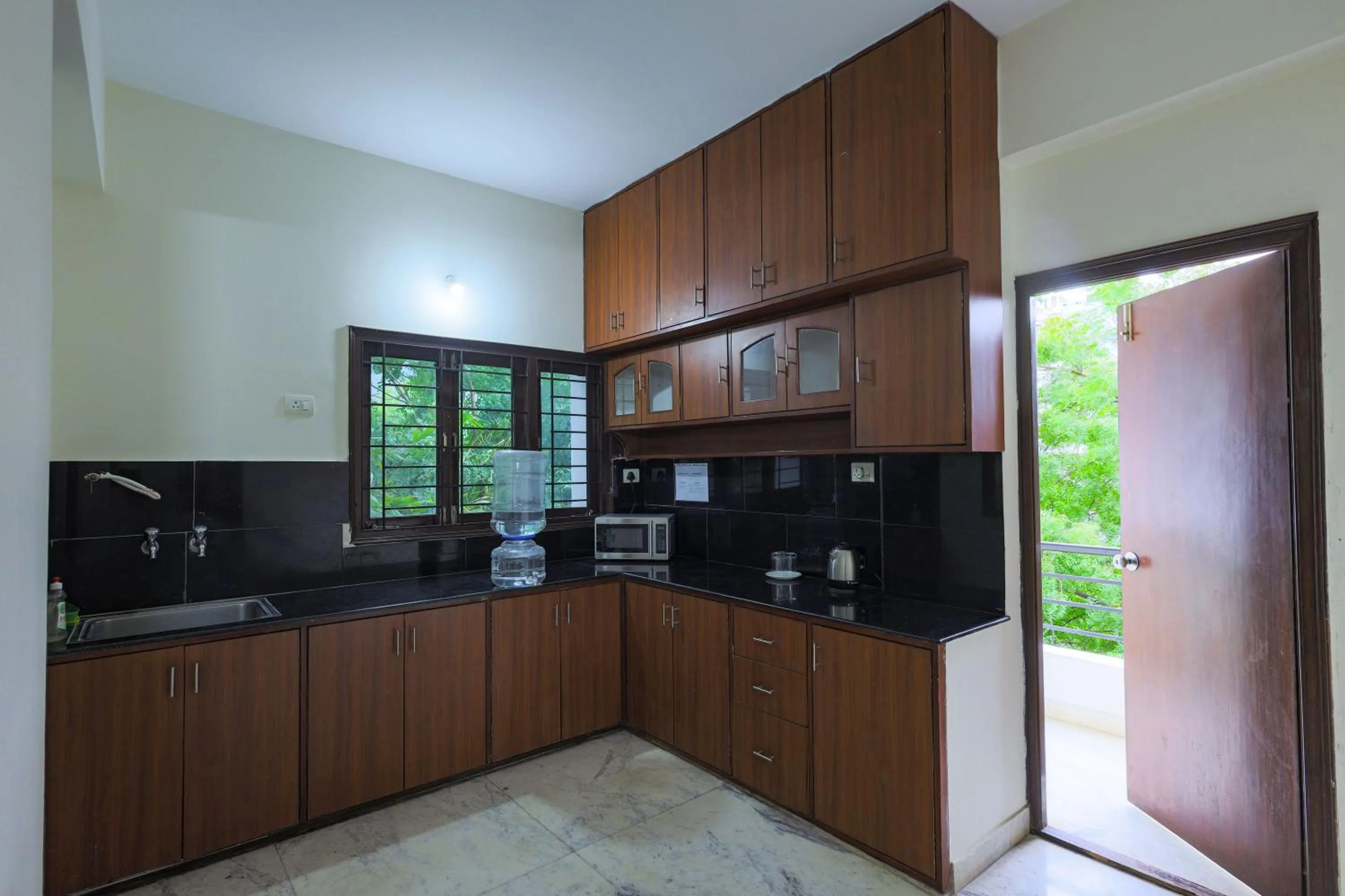 Kitchen or kitchenette in Hotel Athome & Serviced Apartments by Deccan Serai Hotels