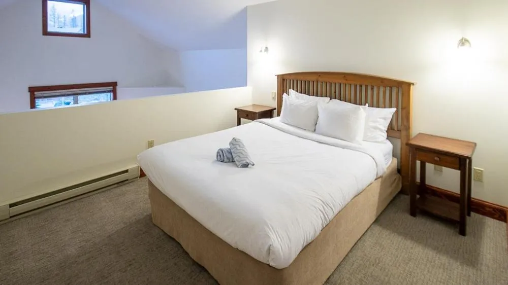 Bed in Timberline Lodges by Fernie Lodging Co
