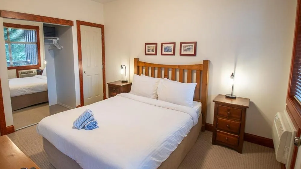 Bed in Timberline Lodges by Fernie Lodging Co