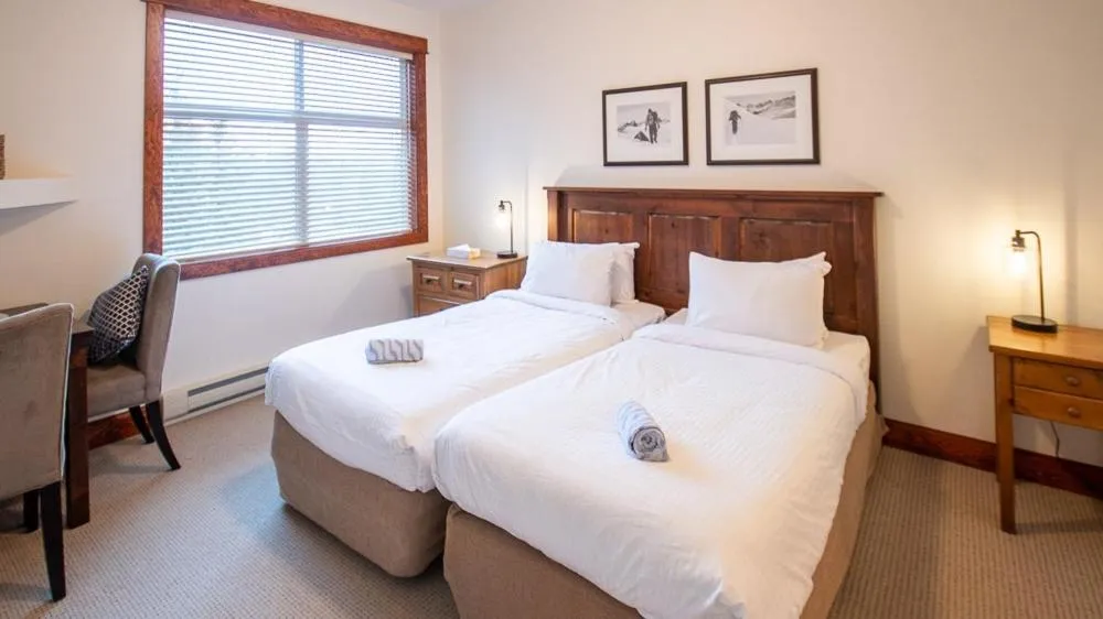 Bed in Timberline Lodges by Fernie Lodging Co