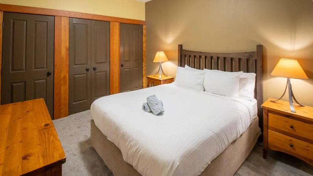 Bed in Timberline Lodges by Fernie Lodging Co