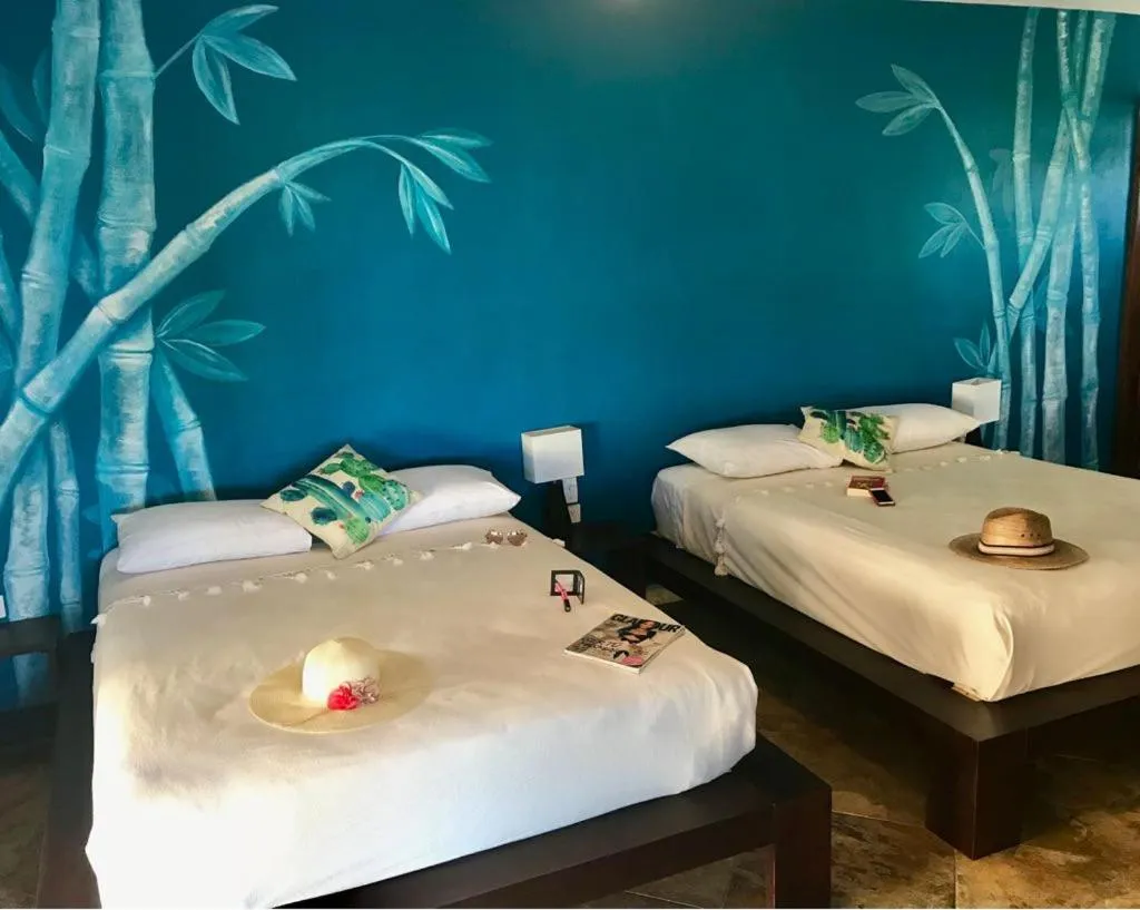 Photo of the whole room, Bed in Hotel Luna De Plata Mahahual