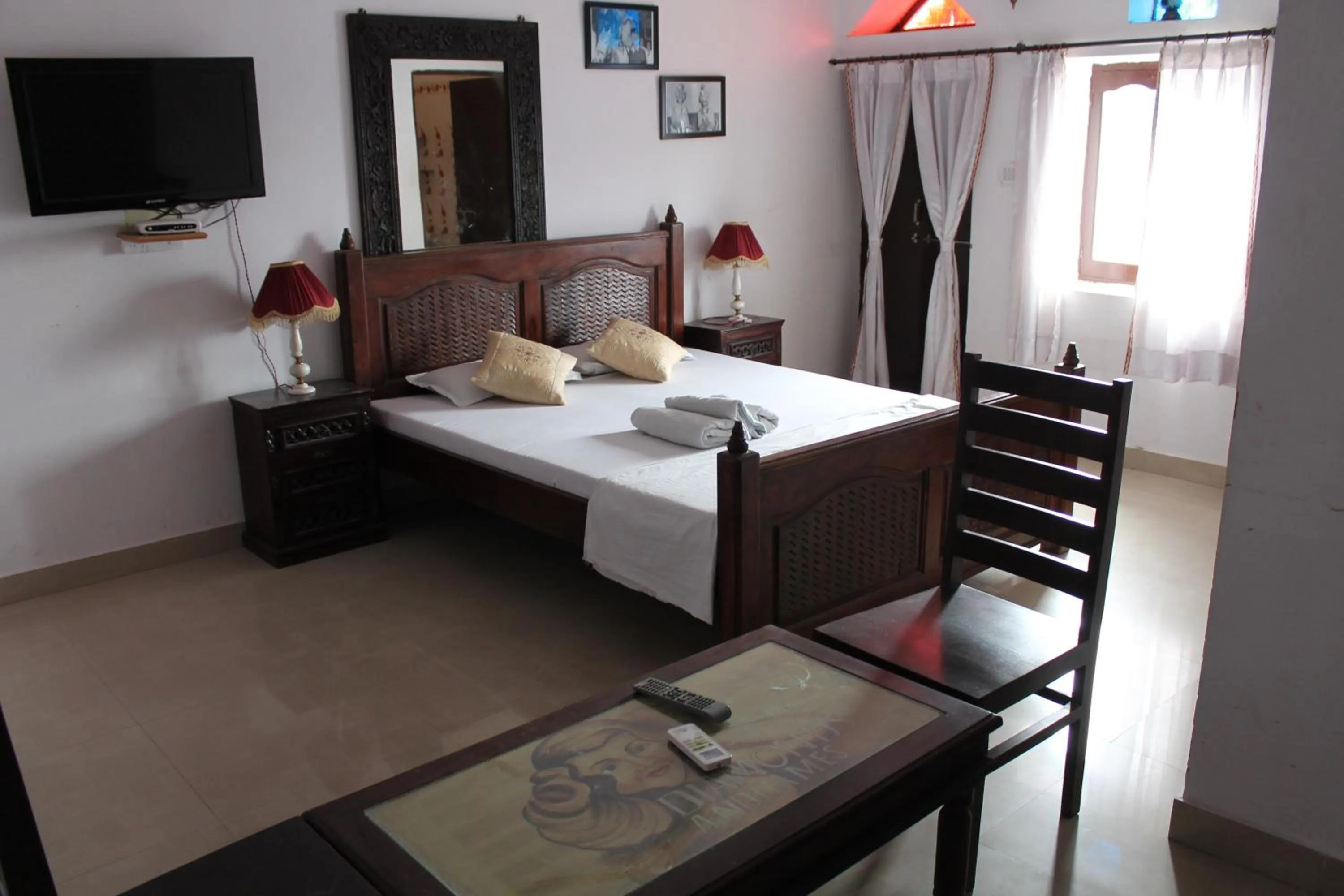 Bed in Kesar Heritage Boutique Home Stay