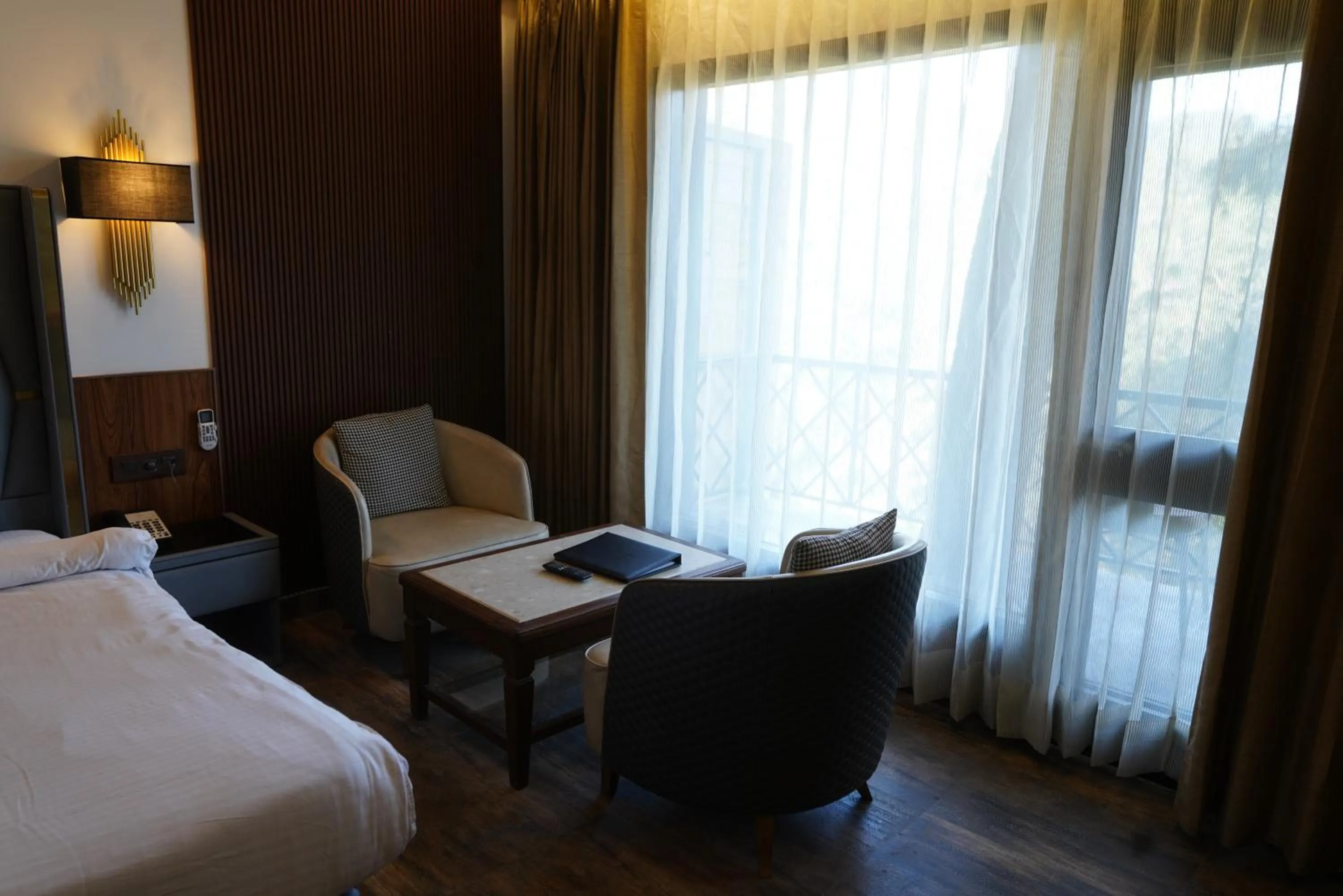 Seating area, Bed in Kasauli Hills Resort