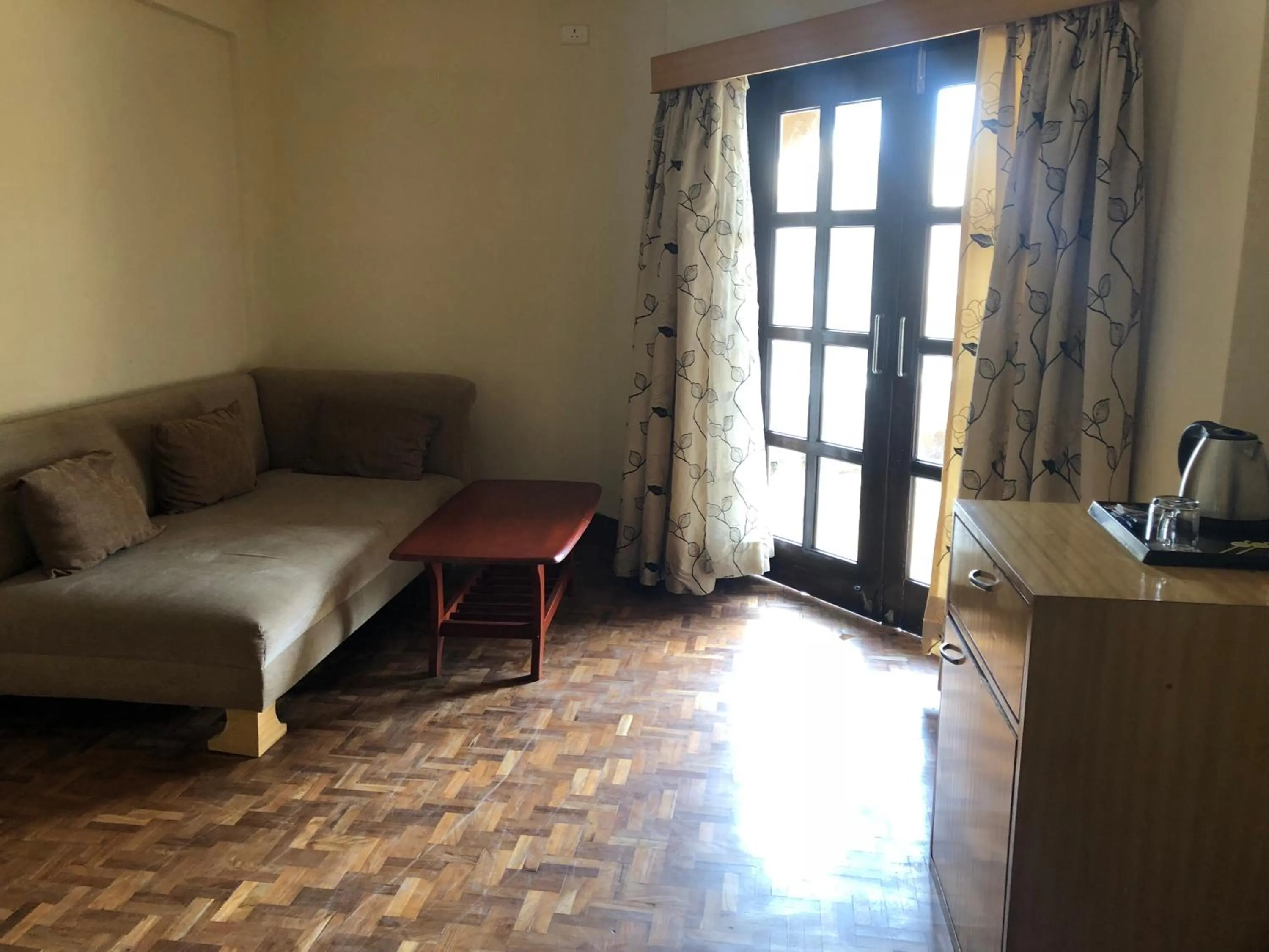 Living room, Bed in The Chariot Resort and Spa