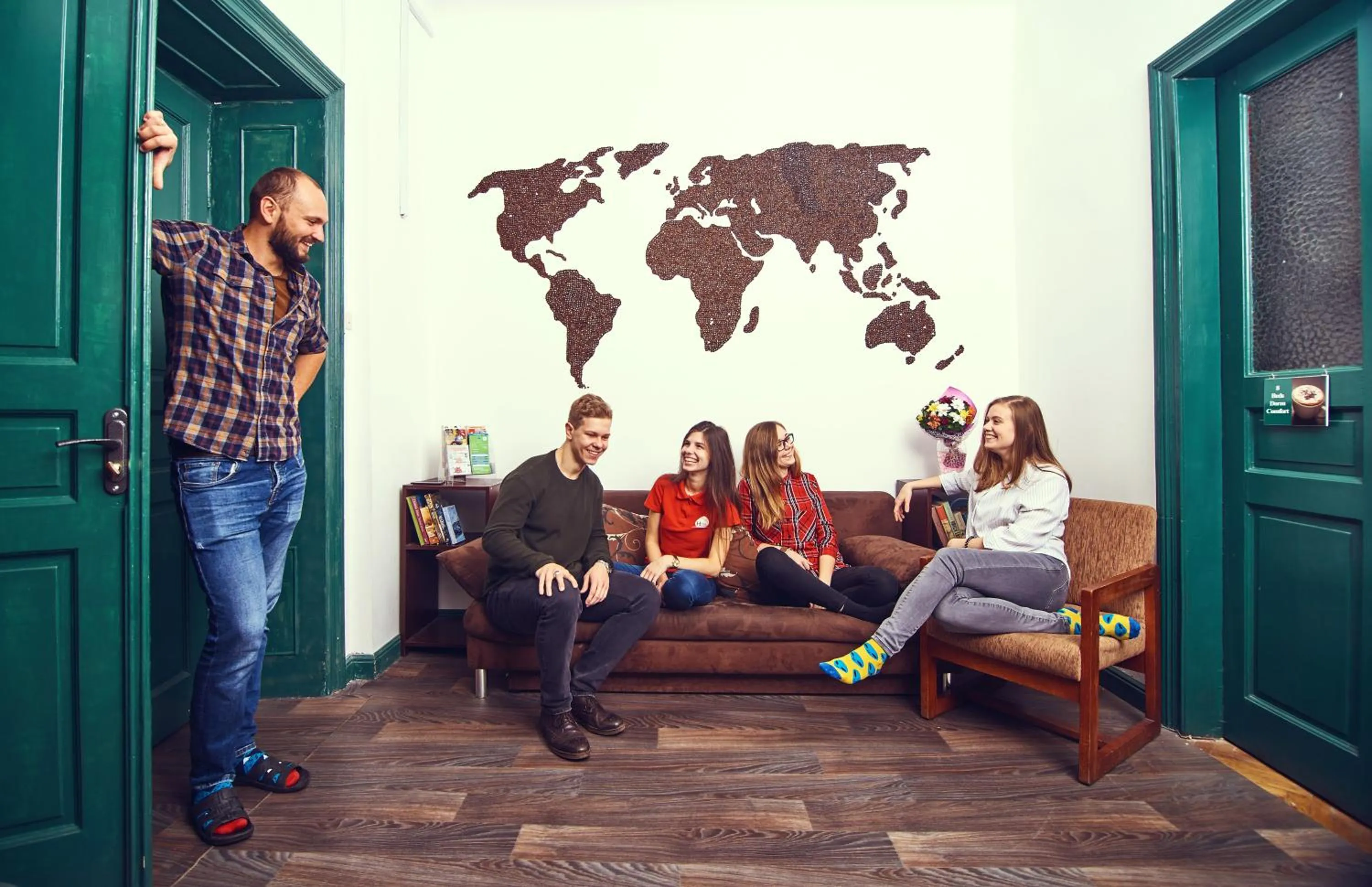 Communal lounge/ TV room in Coffee Home Hostel