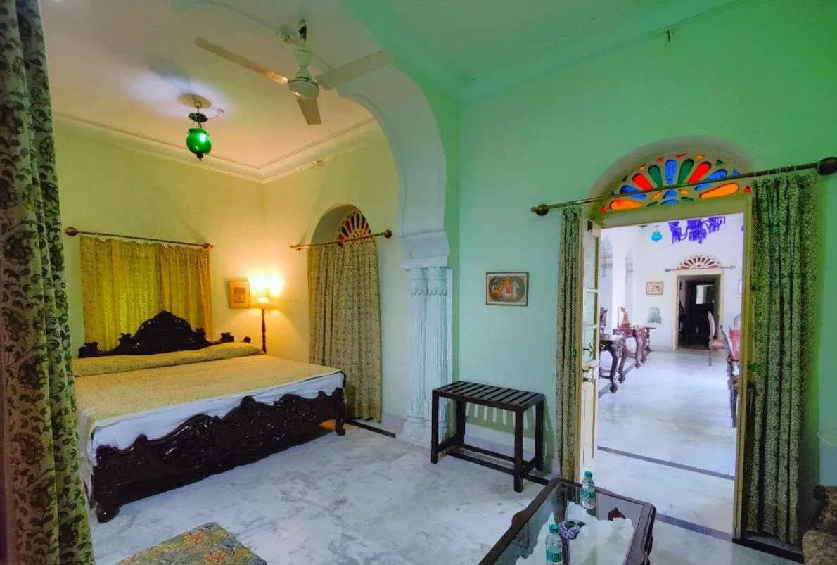 Bed in Palkiya Haveli - Heritage Hotel