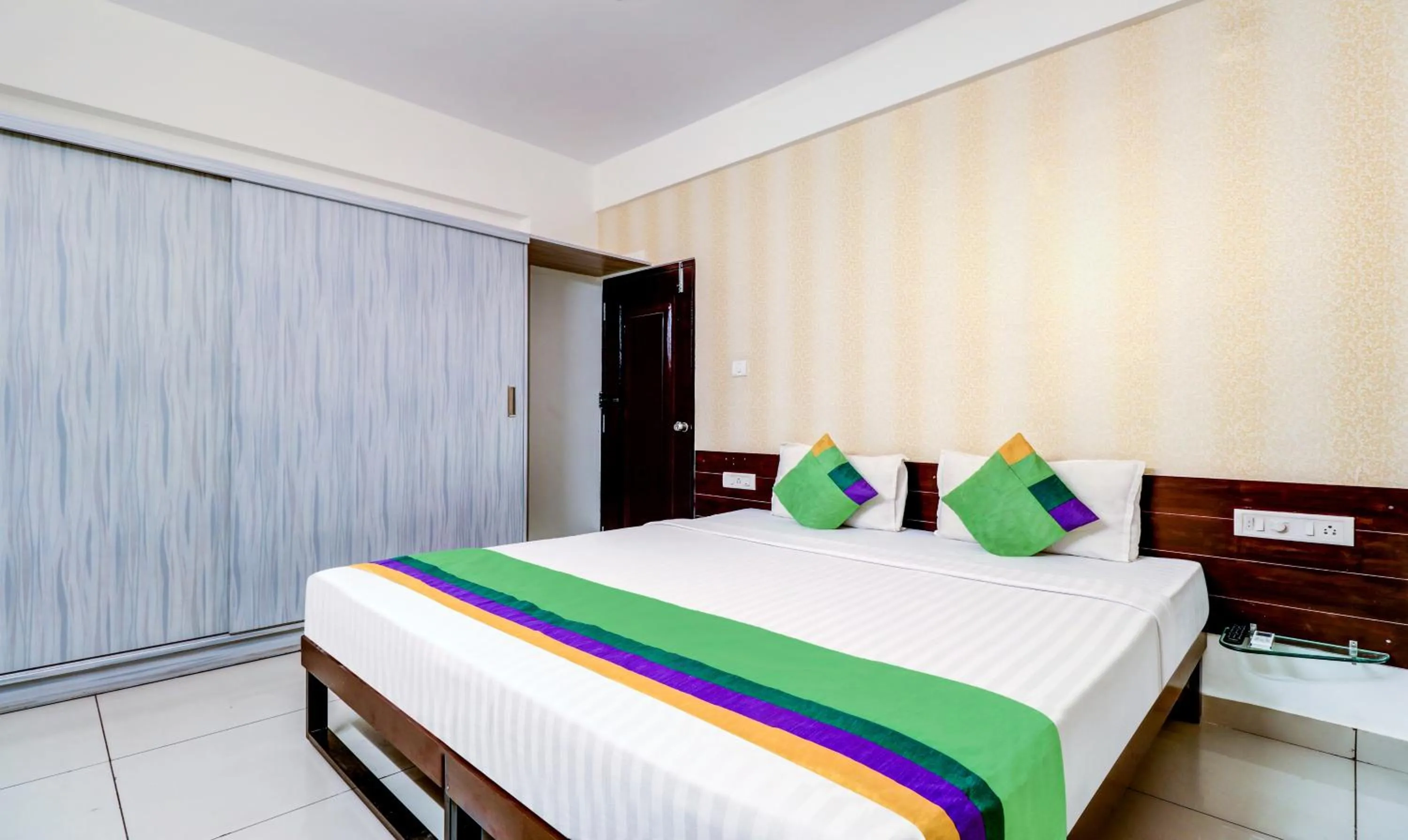 Bedroom, Bed in Treebo Saga Apartment