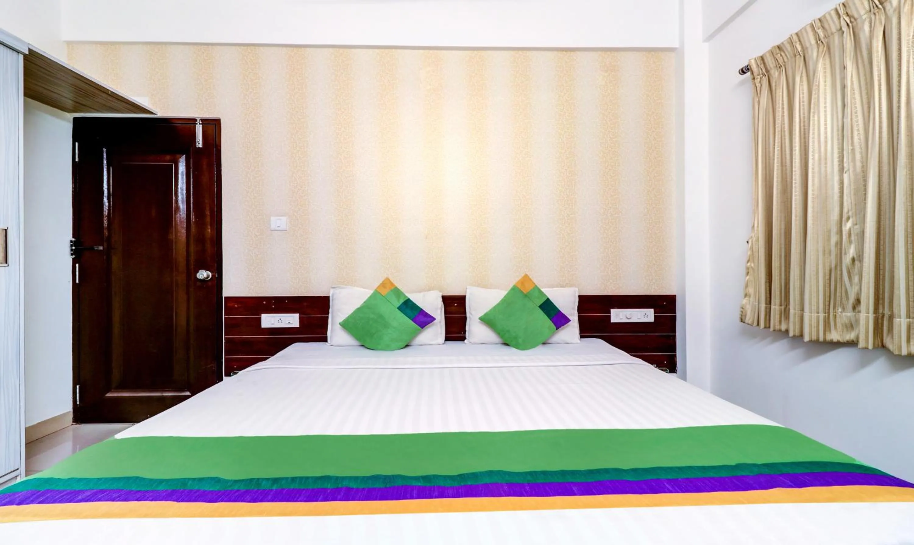 Bedroom, Bed in Treebo Saga Apartment