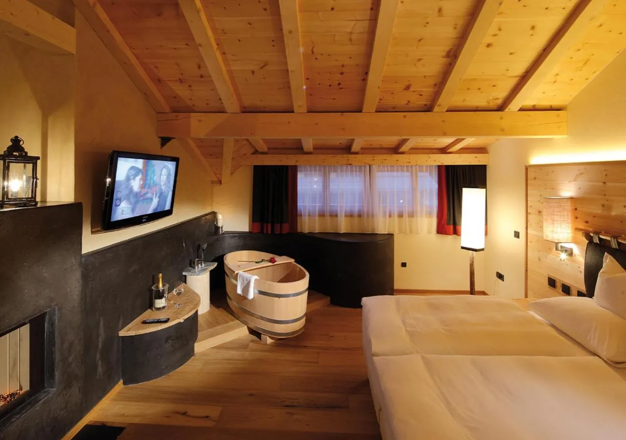 Photo of the whole room, Bed in Dolomites Living Hotel Tirler
