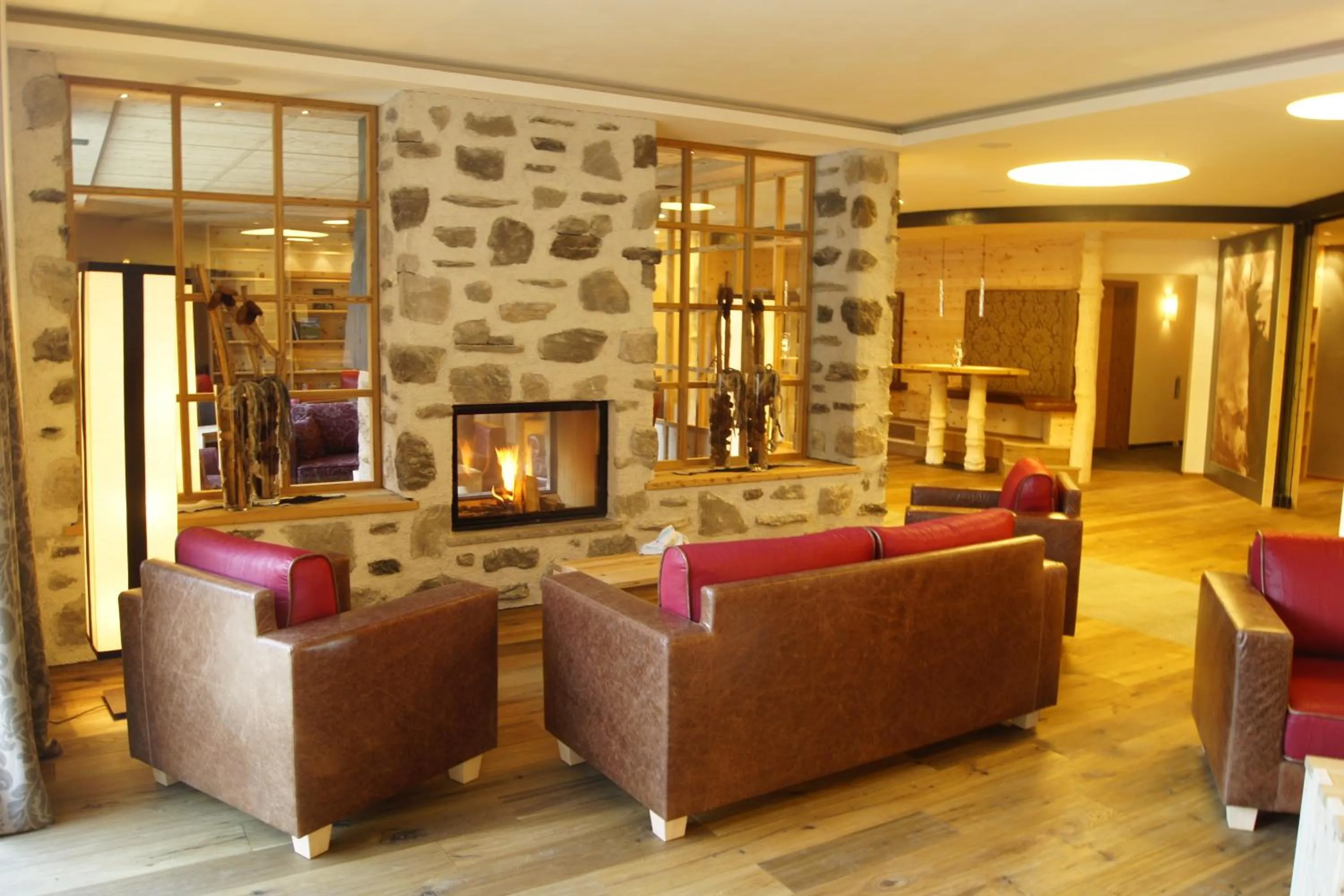Communal lounge/ TV room in Dolomites Living Hotel Tirler