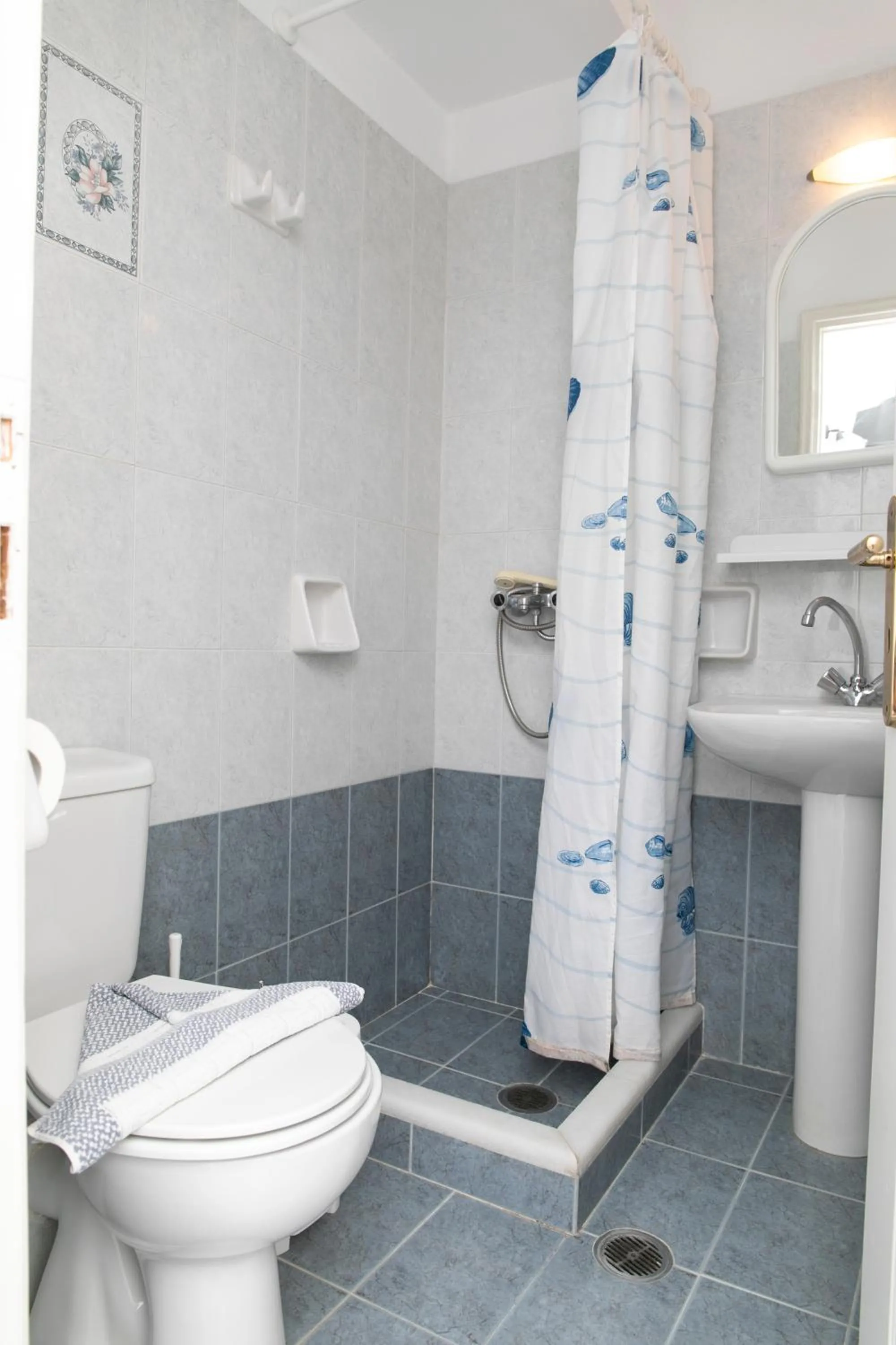 Bathroom in Flora Apartments & Studios