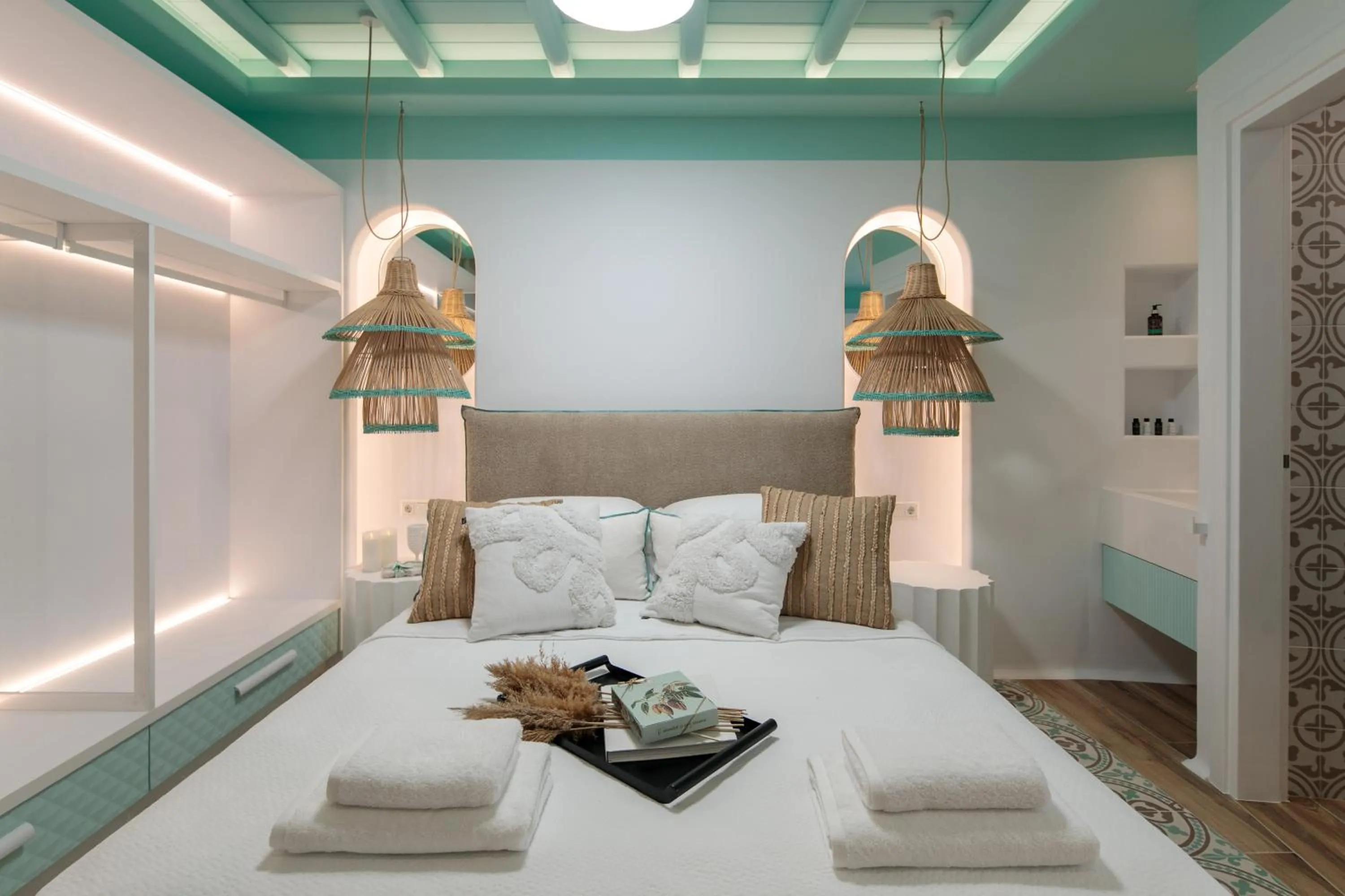 Bed in Flora Apartments & Studios