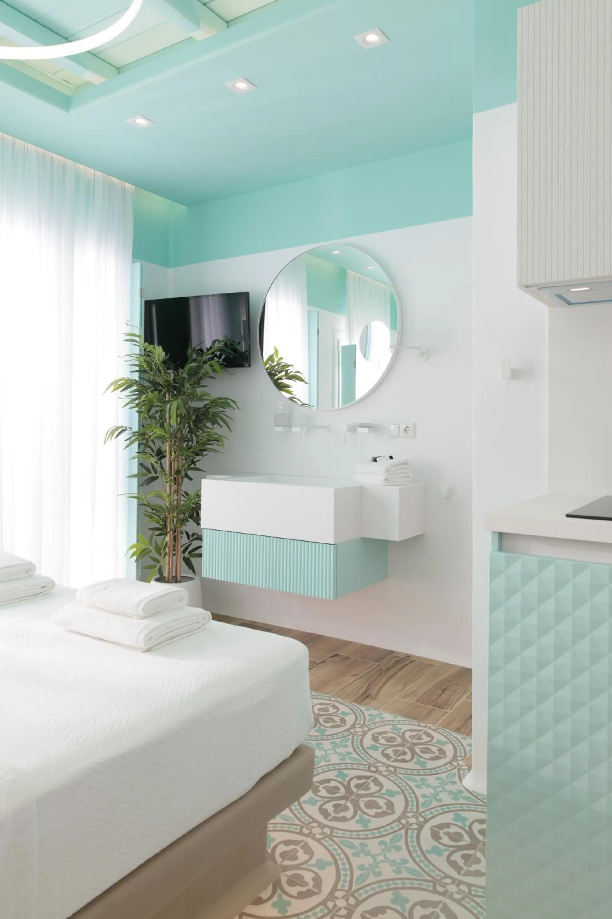 Bed in Flora Apartments & Studios