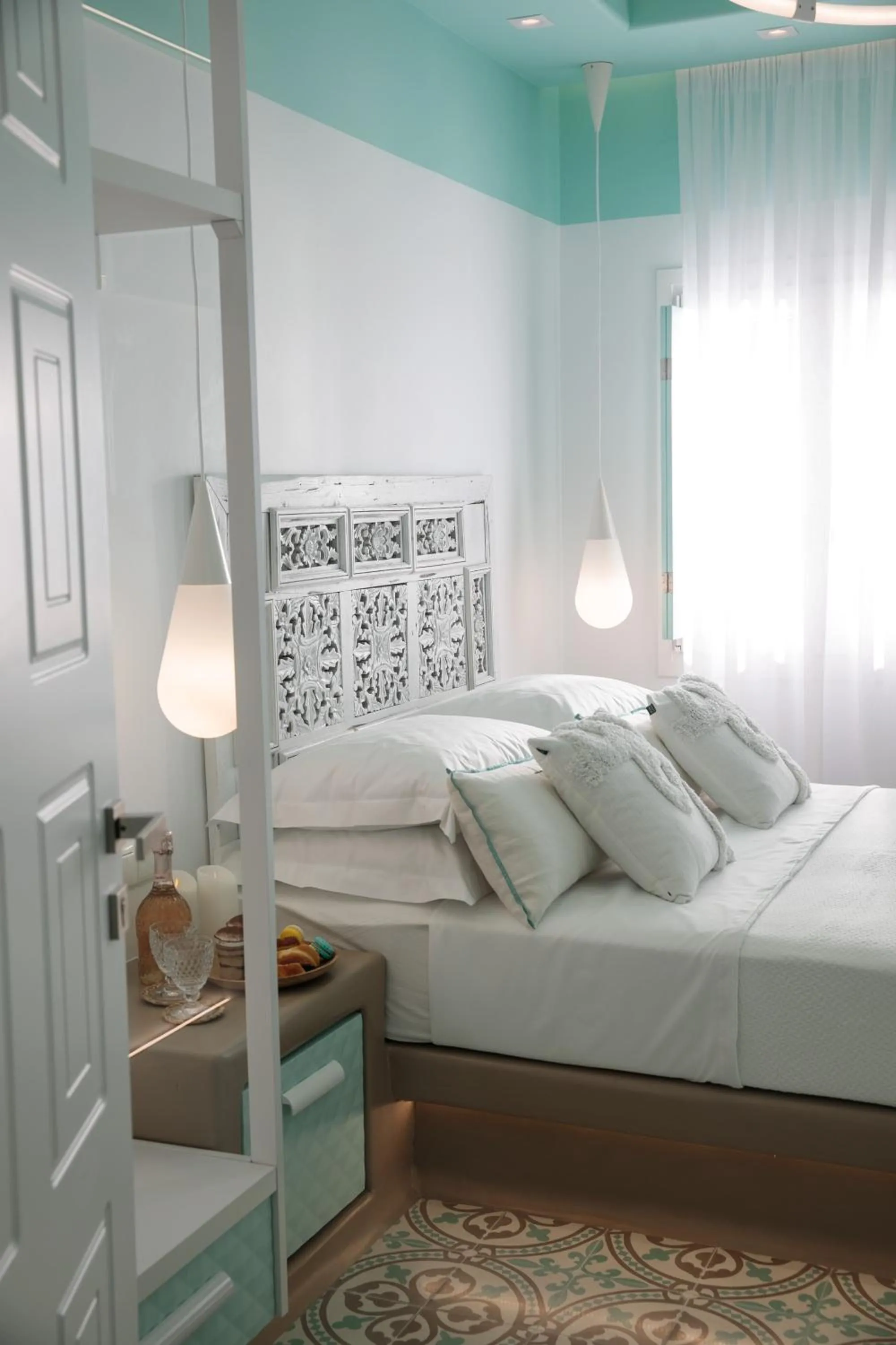 Bed in Flora Apartments & Studios