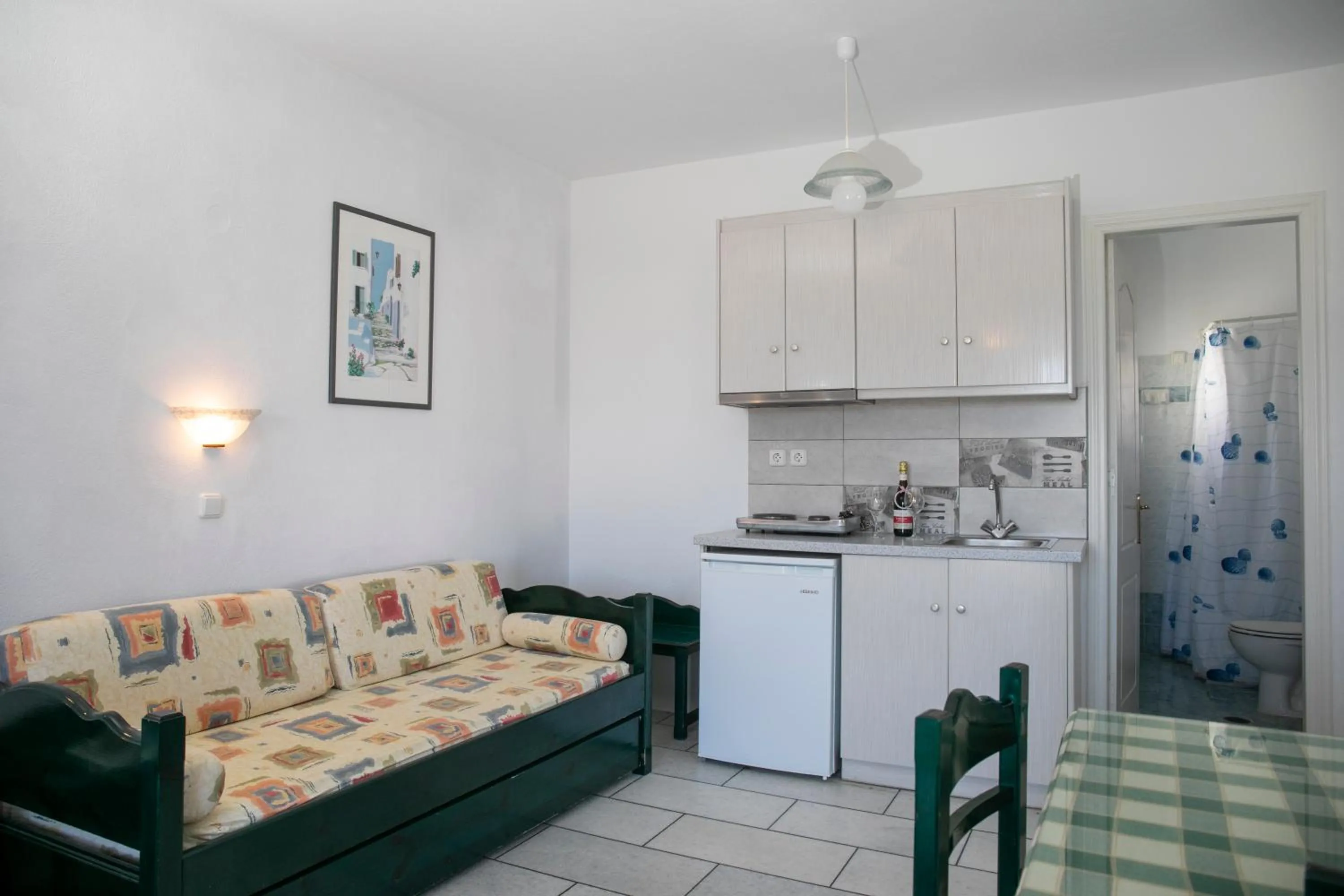 Kitchen or kitchenette in Flora Apartments & Studios