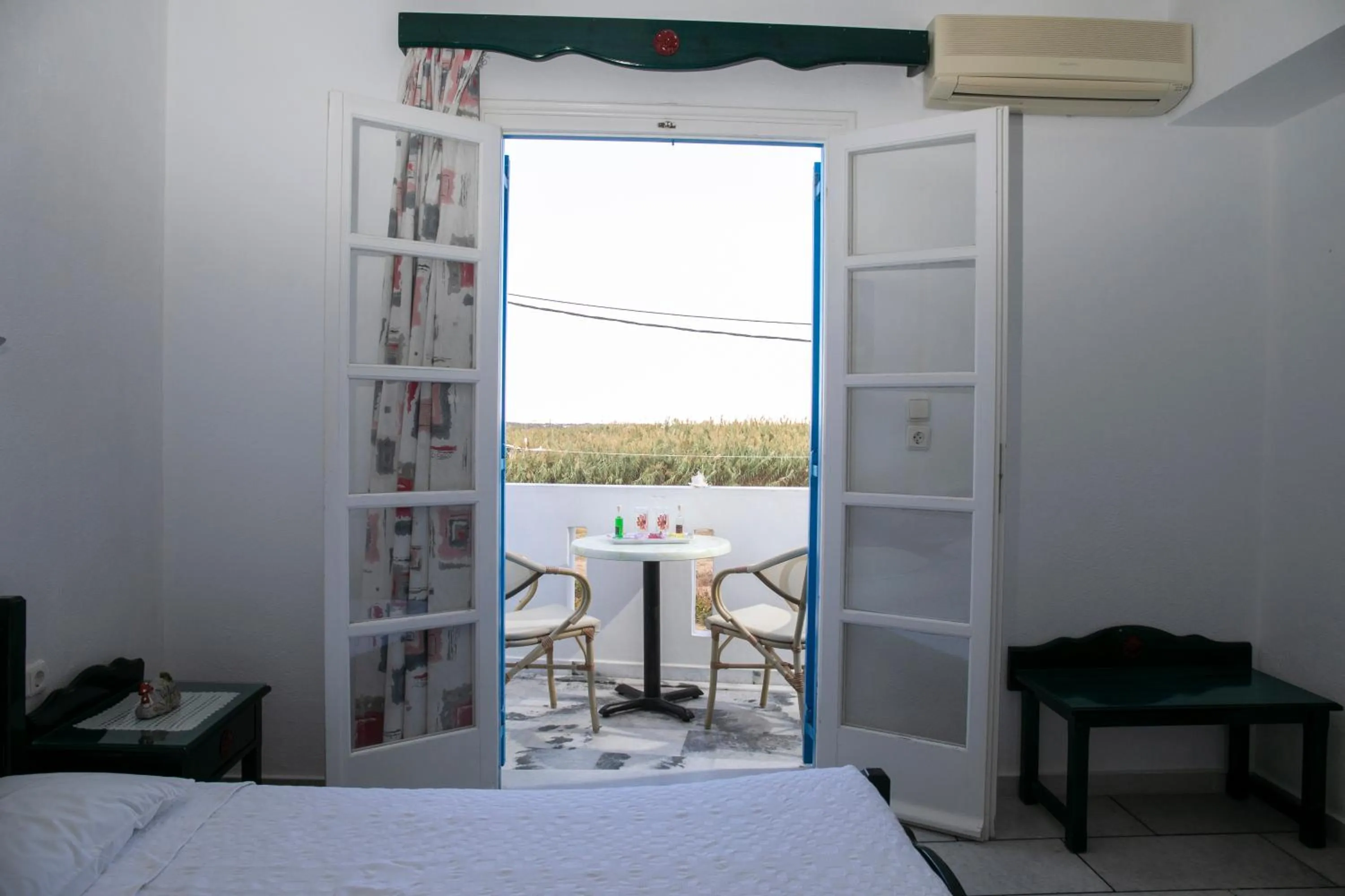 Balcony/Terrace, Bed in Flora Apartments & Studios