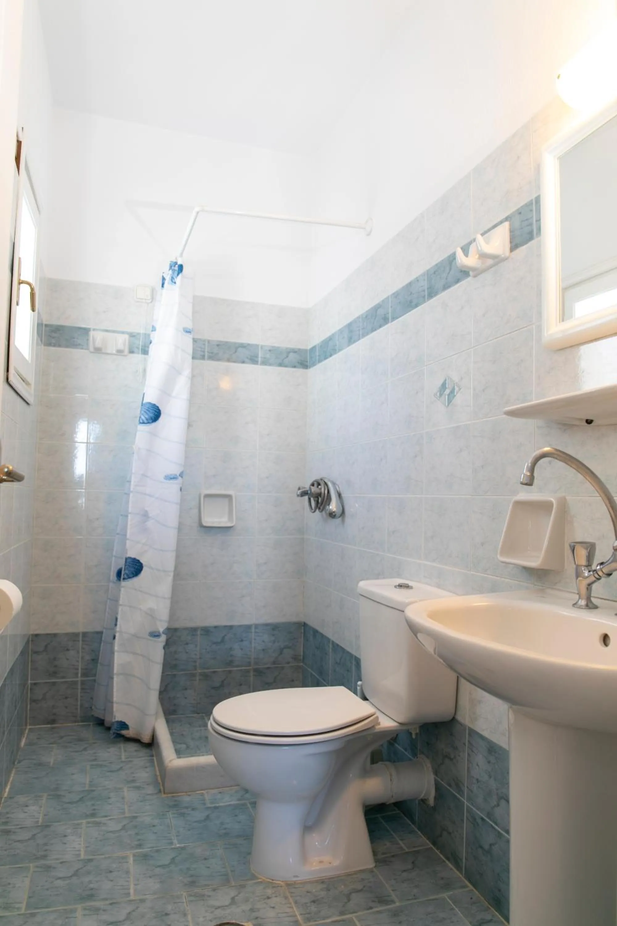 Bathroom in Flora Apartments & Studios
